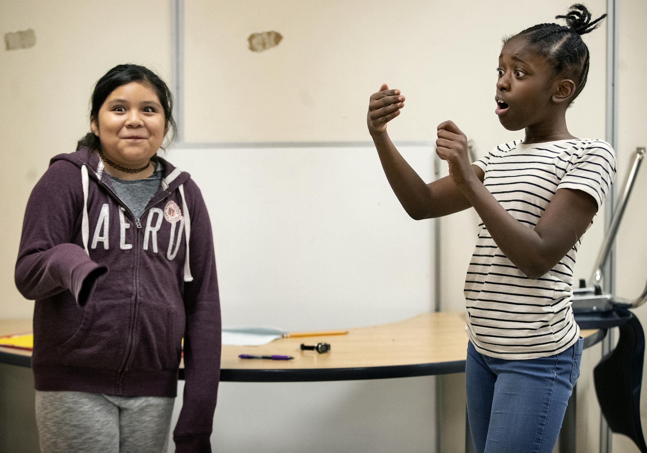 Alexandra Guiterrez, 11, and Ahrinah Cain, 12, during an improv class at United Community School. ] CARLOS GONZALEZ ï cgonzalez@startribune.com ñ November 13, 2018, Minneapolis, MN, United Community School, Keren Gudeman started a new nonprofit that works with kids and parents. It's half improv and half a makers space. Libraries and schools are already booking her.