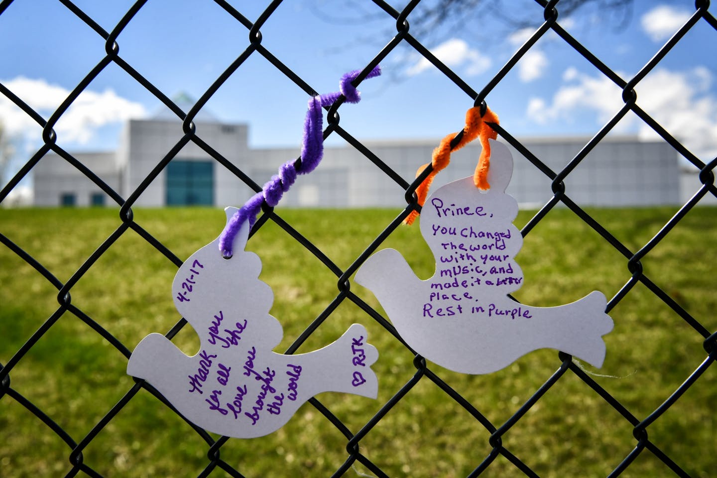 White paper doves on the fence outside Prince's Paisley Park on the first anniversary of his death.