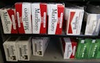 FILE - In this April 17, 2014 file photo, Philip Morris' Marlboro cigarettes are on display at a market in Palo Alto, Calif. Philip Morris Internation
