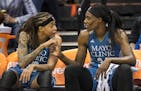 Minnesota Lynx guard Seimone Augustus (33) and center Sylvia Fowles (34) shared a moment on the bench during the fourth quarter Saturday. ] (AARON LAV