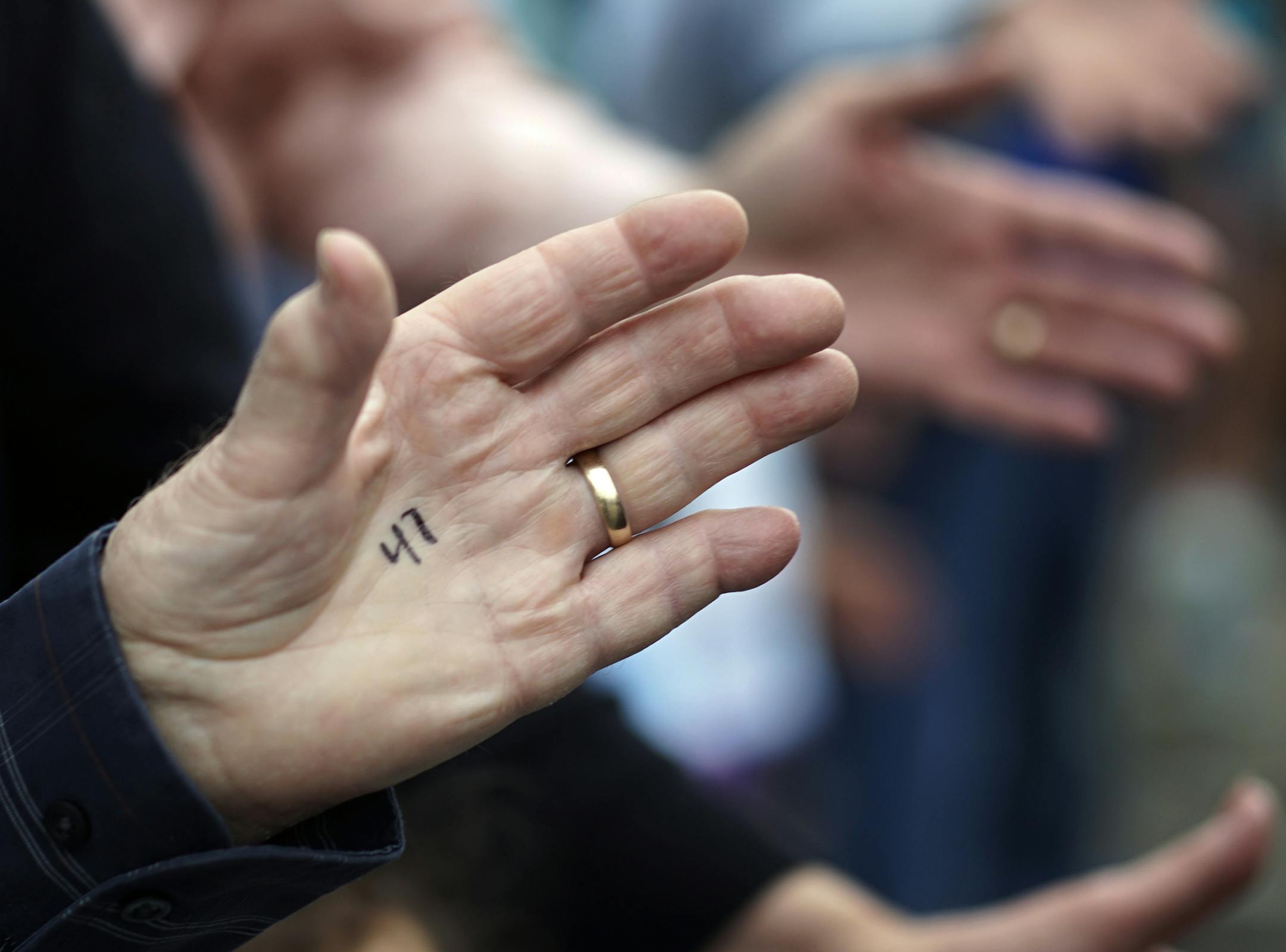 At Silverwood Park in St. Anthony Main on National High Five Day, people had each hand numbered. There were over 130 people present: enough to help Molly Vergin to set the record .] Richard Tsong-Taatarii/rtsong-taatarii@startribune.com