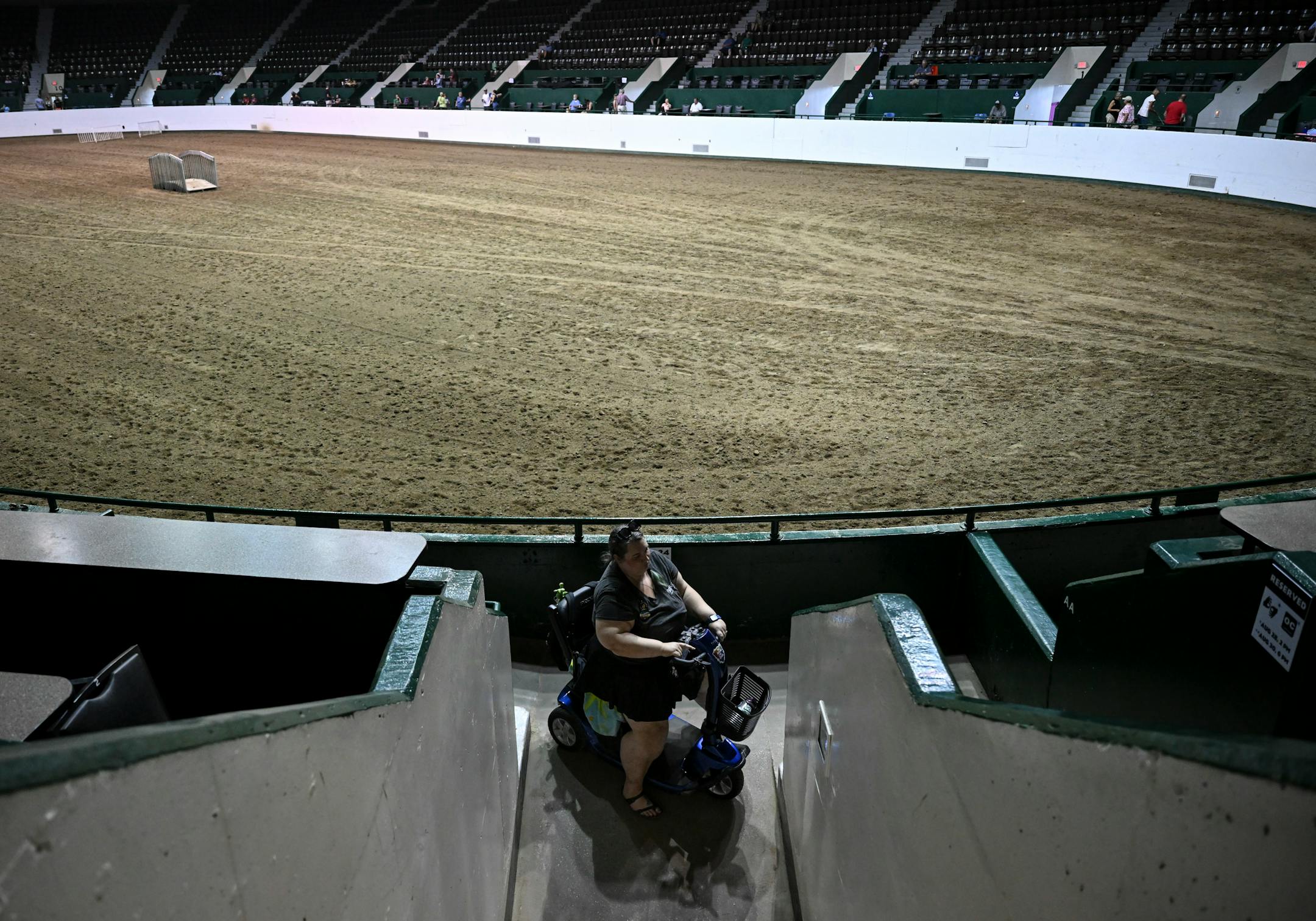 Jillian Nelson, a disability advocate with the Autism Society of Minnesota (AUSM), tries to turn her scooter around in a tight and steep ramp inside the Lee &amp; Rose Warner Coliseum. The coliseum in the past provided a quiet space which helps with Nelson's autism, but there are accessibility issues now that she uses a scooter.