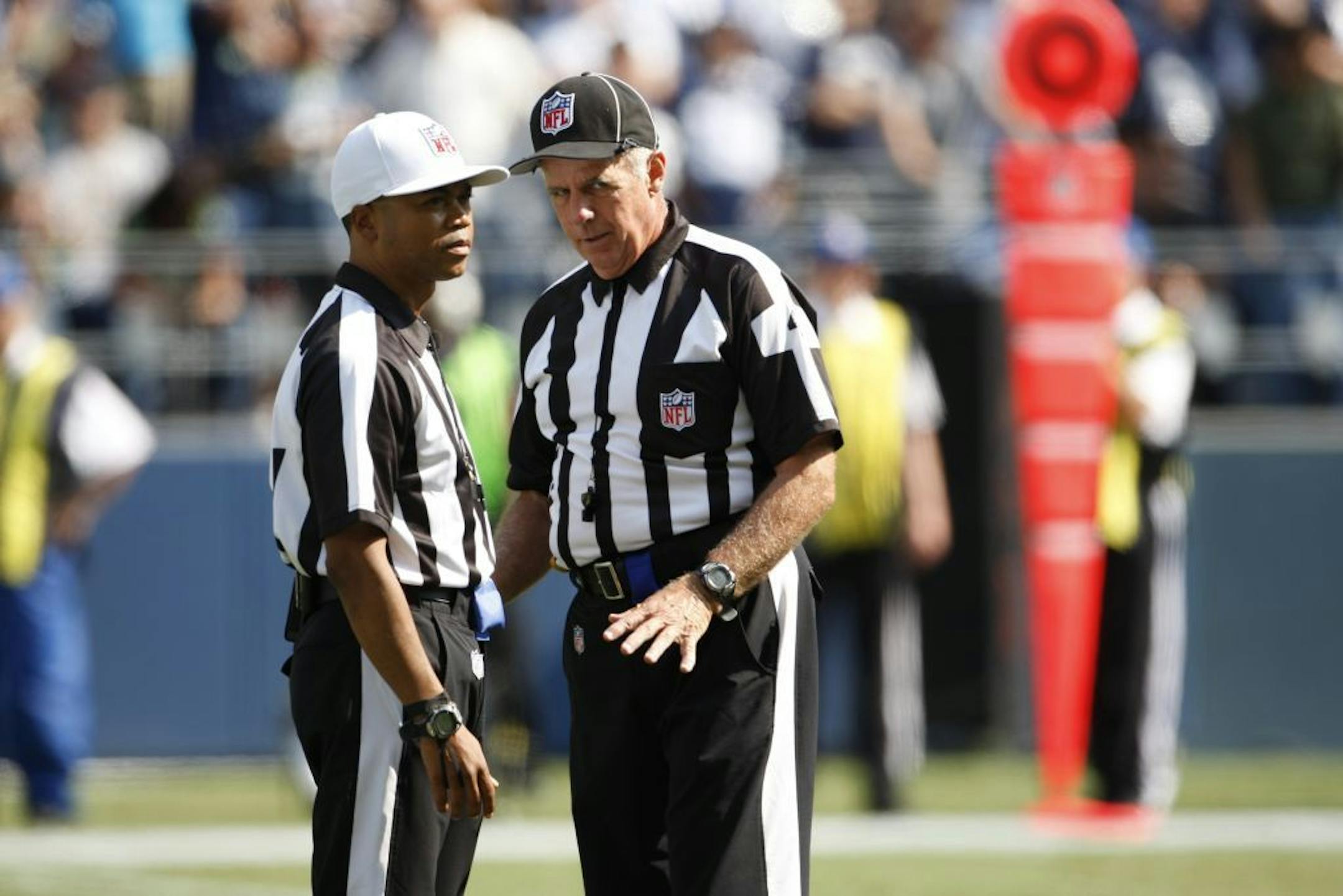 Referees during the in the first half of the game between the Dallas Cowboys and Seattle Seahawks on Sunday, Sept. 16, 2012, in Seattle.