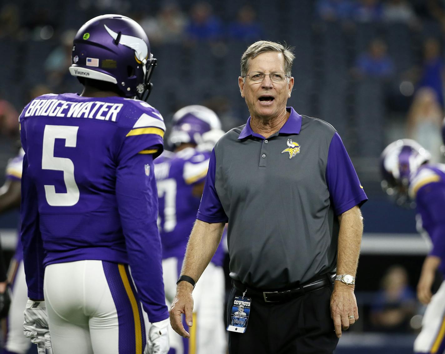 Minnesota Vikings' Teddy Bridgewater (5) talks with offensive coordinator Norv Turner during warm ups before a preseason NFL football game against the Dallas Cowboys Saturday, Aug. 29, 2015, in Arlington, Texas. (AP Photo/Tony Gutierrez) ORG XMIT: MIN2015090210024525