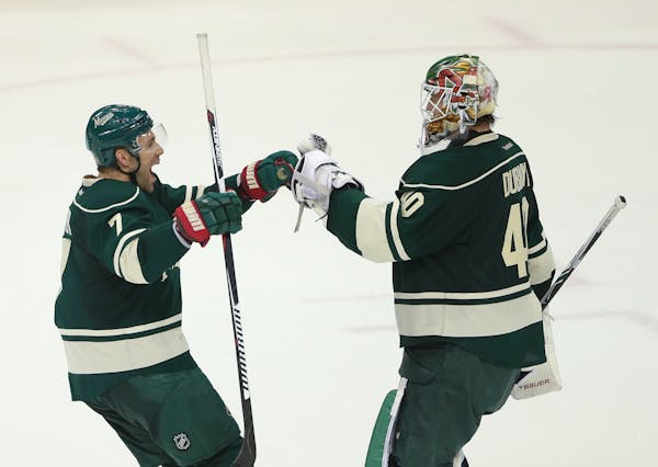 Wild left wing Chris Porter congratulated goalie Devan Dubnyk after stopping a season high 38 shots on the way to the team's third win in a row Tuesda