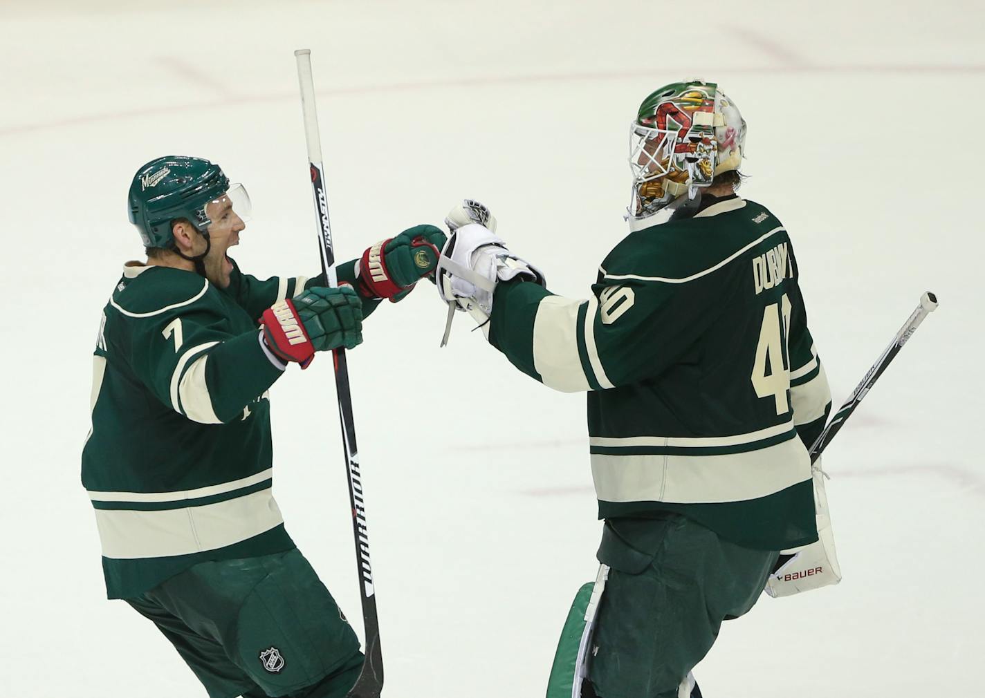 Wild left wing Chris Porter congratulated goalie Devan Dubnyk after stopping a season high 38 shots on the way to the team's third win in a row Tuesday night.