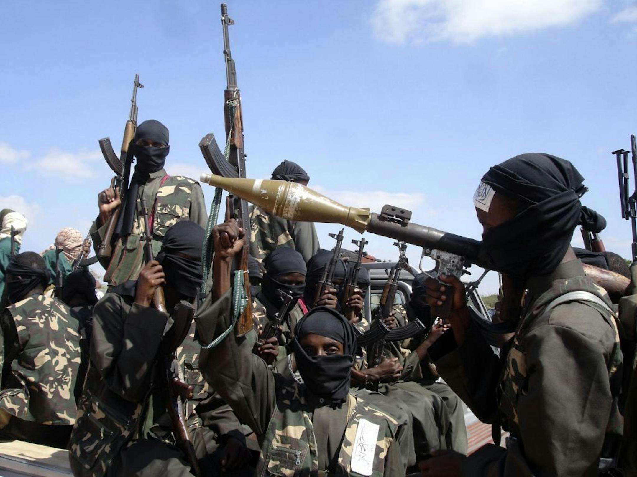2008 photo of al-Shabab fighters just outside Mogadishu near the same southern Somalia village where U.S. Navy SEALS four years ago killed a most-wanted al-Qaida operative.