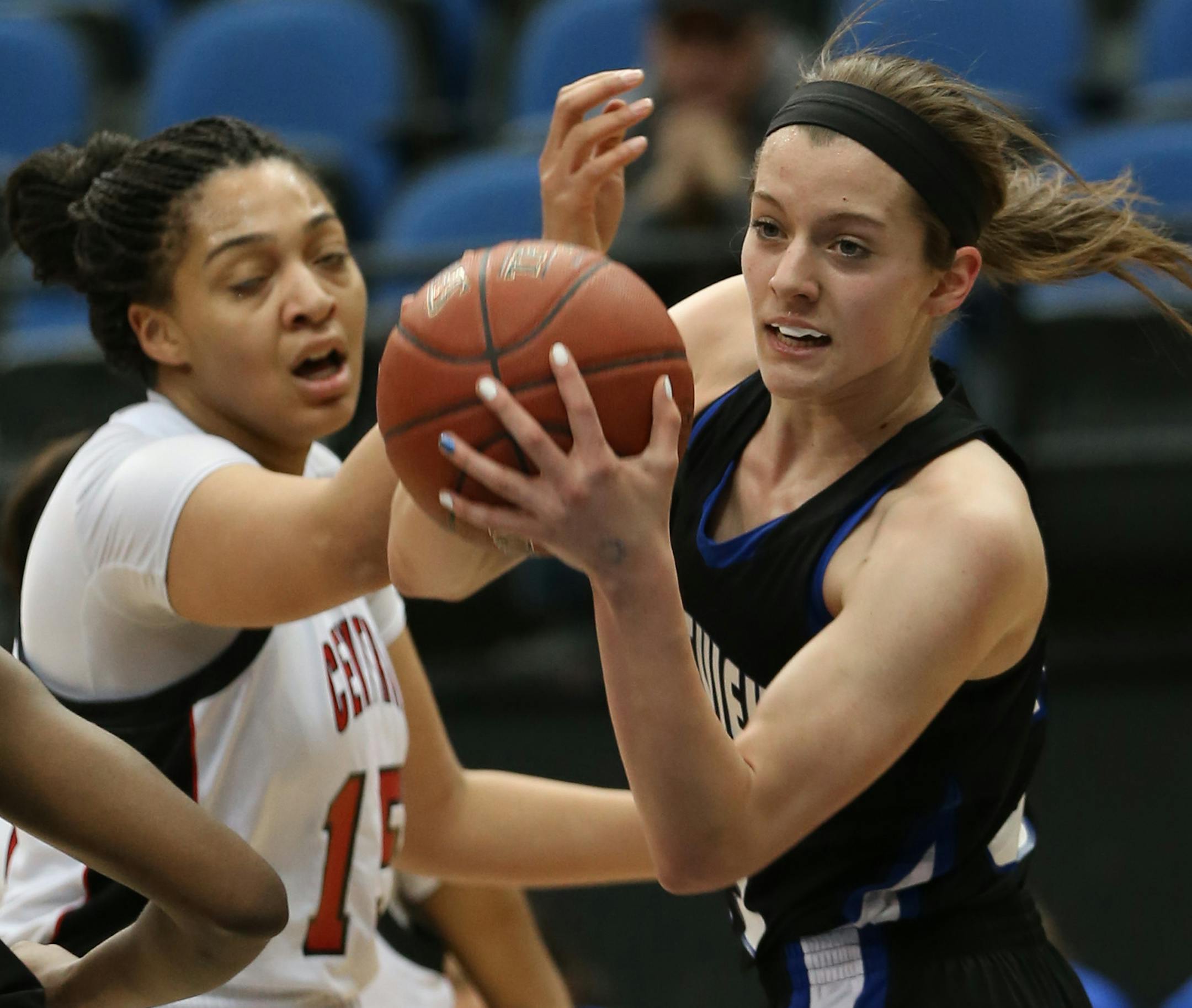 (right) Eastview's Hana Metoxen pulled in a rebound over St. Paul Central.] Girls Basketball Tournament, 3/18/14, Target Center, Class 4A Eastview vs St. Paul Central. Bruce Bisping/Star Tribune bbisping@startribune.com Hana Metoxen/roster.