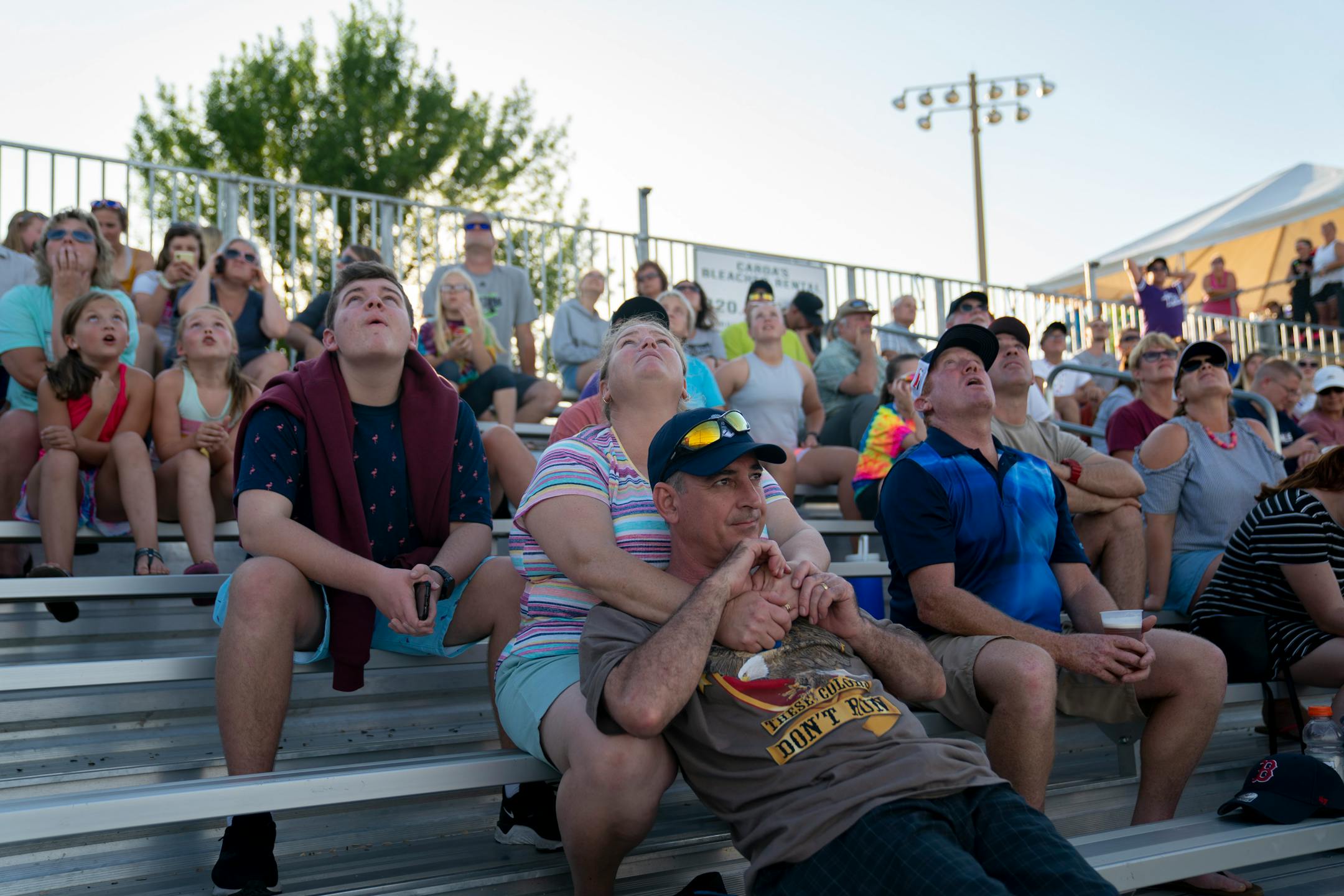 Amanda Mann followed a foul ball as she embraced her husband Steve Mann during an Aussie Peppers' game against the Canadian wild in North Mankato, Minn. Wednesday, July 3, 2019. The Mann's are from Australia and were in town for their daughter's youth softball tournament. ] RENEE JONES SCHNEIDER ¥ renee.jones@startribune.com