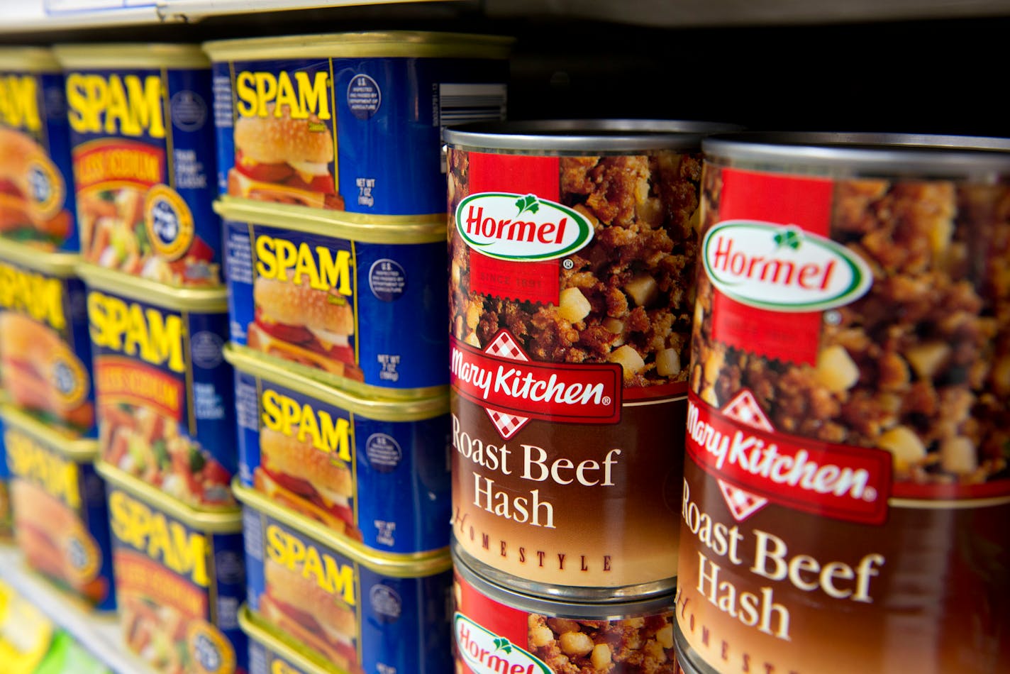 Hormel Foods Corp. Roast Beef Hash and Spam brand lunchmeat sit on display in a supermarket in Princeton, Illinois, U.S., on Thursday, Jan. 3, 2013. Hormel Foods Corp., the maker of Spam lunchmeat, agreed to buy the Skippy peanut-butter business from Unilever NV for about $700 million, expanding its presence beyond meats and further into China. Photographer: Daniel Acker/Bloomberg