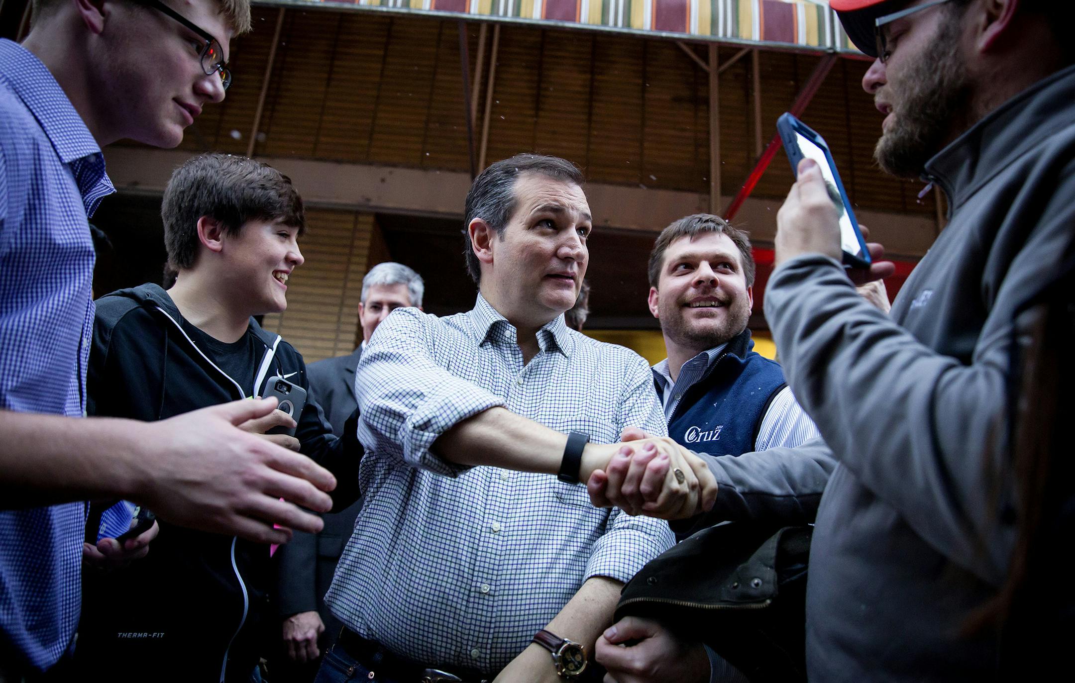 Republican presidential hopeful Sen. Ted Cruz of Texas arrives for a campaign event at a coffee shop in Charles City, Iowa, Jan. 8, 2016. Cruz is on a six-day, 28-town swing through Iowa. (Eric Thayer/The New York Times) ORG XMIT: MIN2016011213141859
