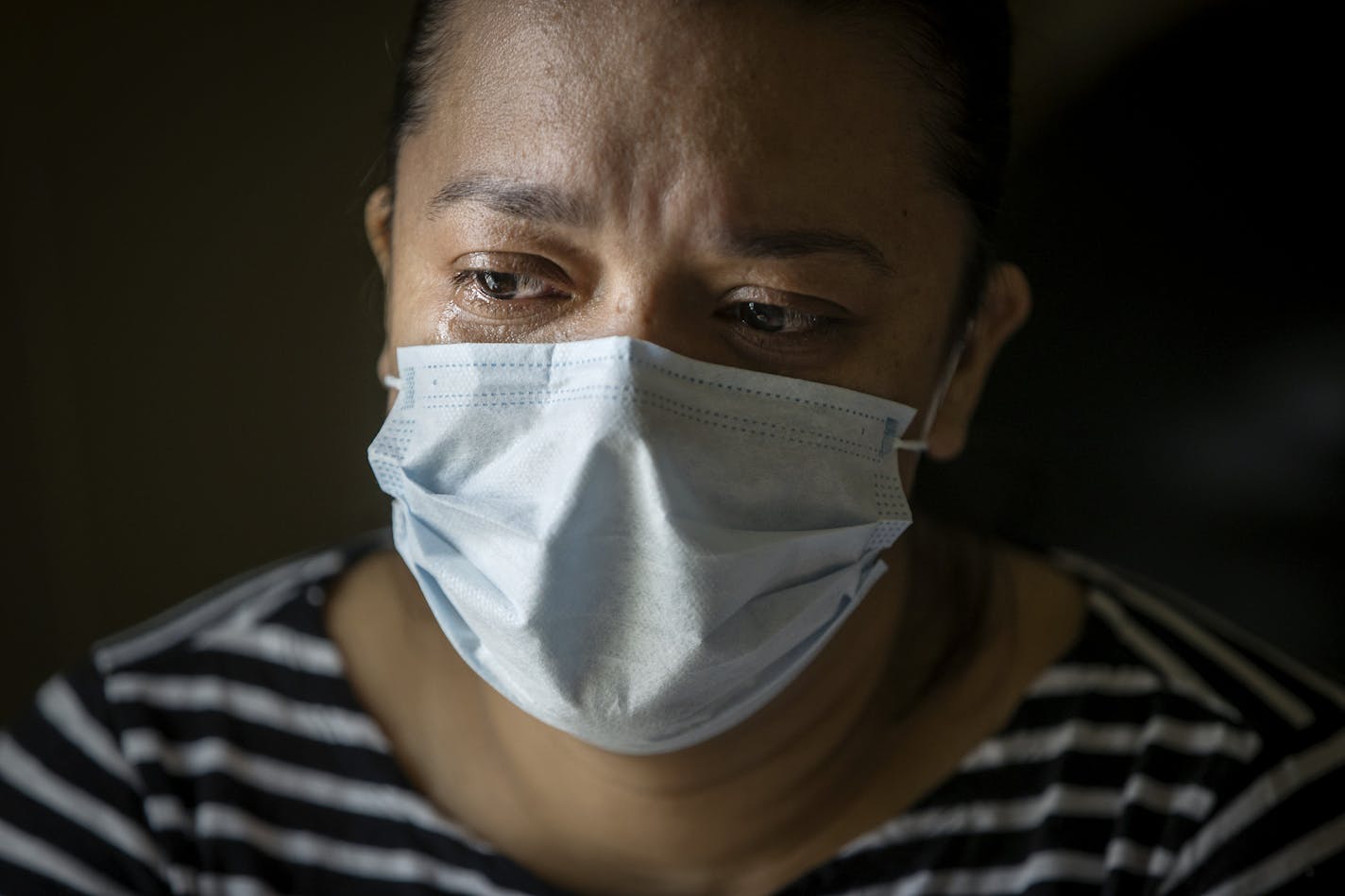 "The hardest part of all of this is having your daughter tell you not to cry," said Jamari of her daughter Estefany, 8, Thursday, May 7, 2020 in Willmar, MN. Jamari worked in the sanitation department for a third-party contractor inside the Jenny-O plant since last October. She just completed her quarantine and is hopeful of returning to work on Monday. ] ELIZABETH FLORES • liz.flores@startribune.com