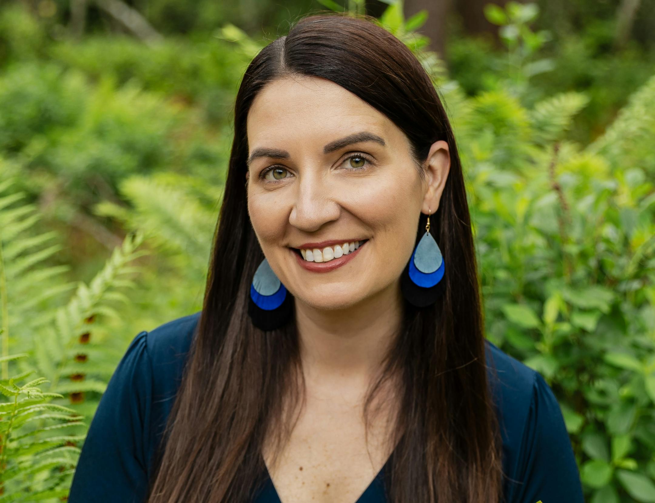 photo of author Vanessa Lillie in front of greenery