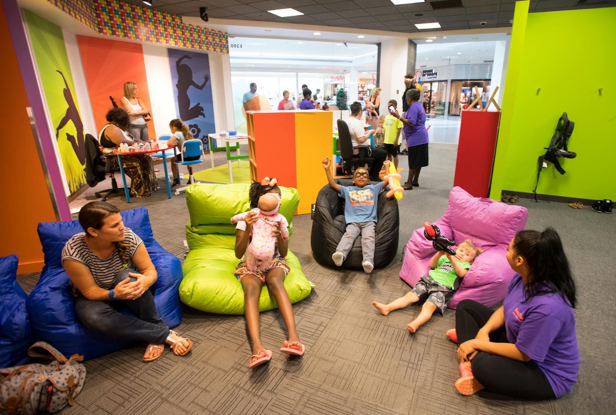 Babysitters, nannies and children hung out near the TV during the grand opening celebration of "Drop 'n Shop" Friday at Mall of America. ] (AARON LAVINSKY/STAR TRIBUNE) aaron.lavinsky@startribune.com A new child care drop-off service called Drop 'n Shop at the Mall of America is opening. It will give parents an option for more stress-free shopping without the kids. We photograph the grand opening celebration on Friday, July 15, 2016 at Mall of America.