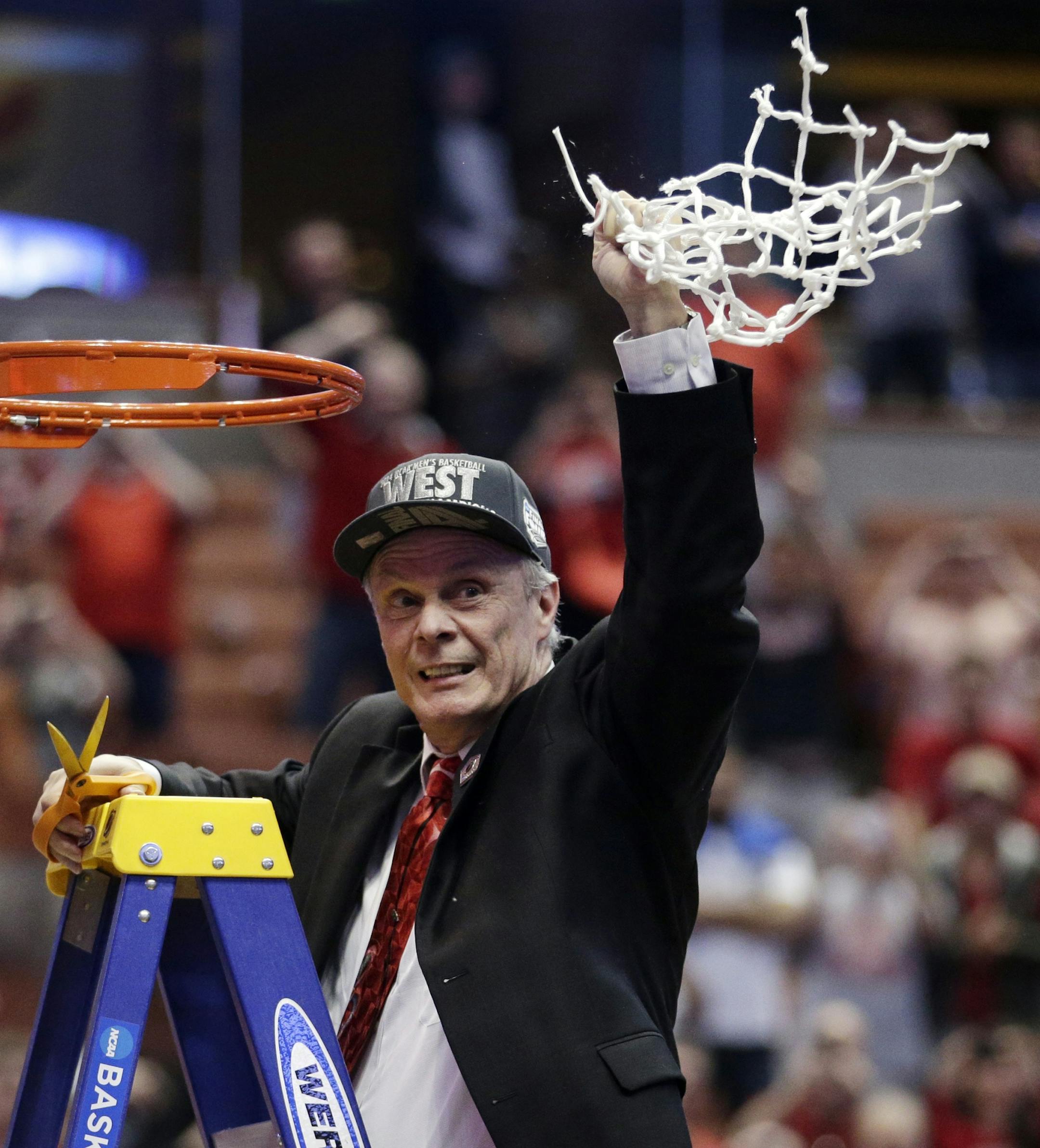 Wisconsin head coach Bo Ryan celebrates after cutting down the net after a regional final NCAA college basketball tournament game against Arizona, Saturday, March 29, 2014, in Anaheim, Calif. Wisconsin won 64-63 in overtime. (AP Photo/Jae C. Hong)