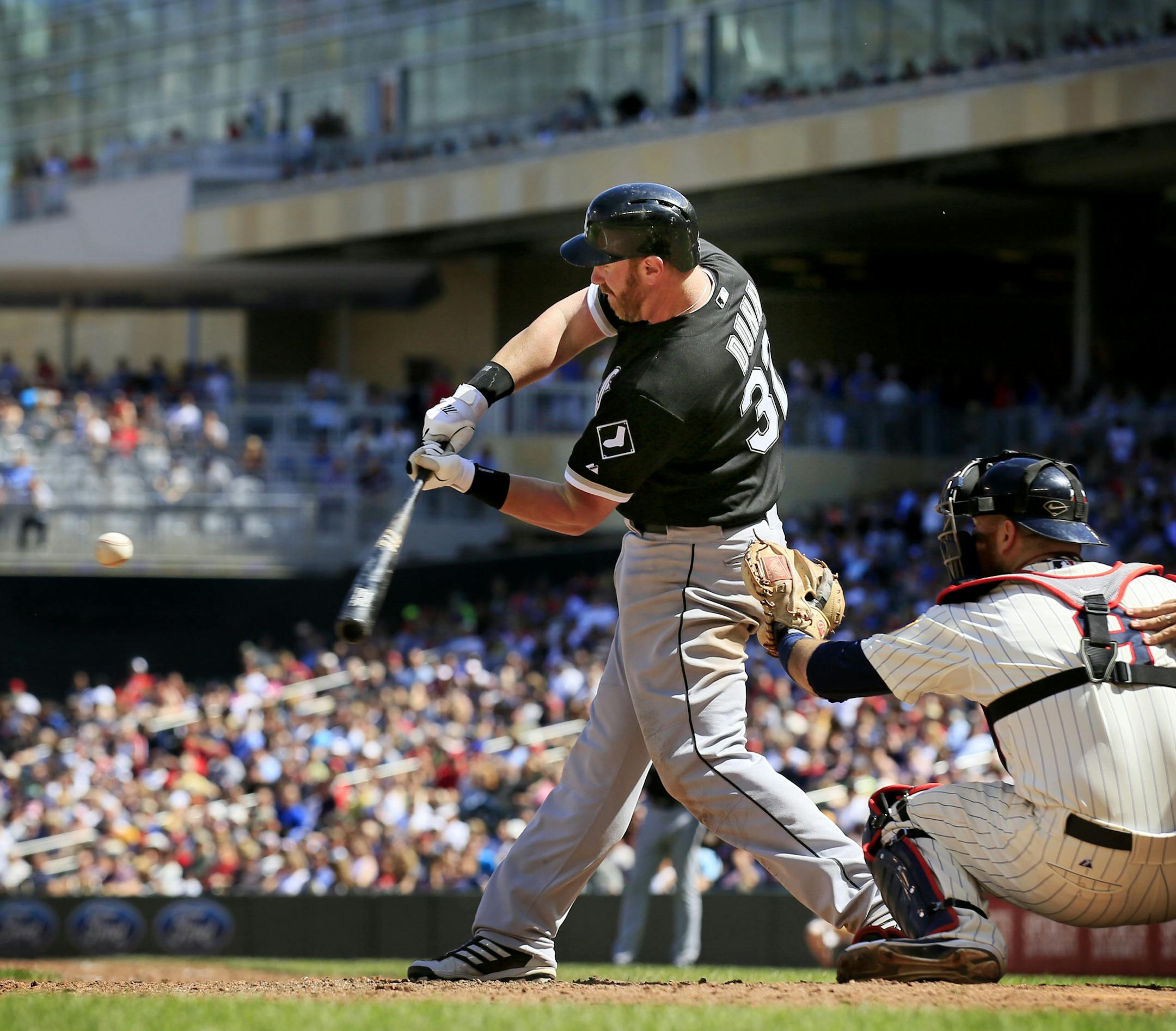 Chicago's Adam Dunn connects with his 2nd, 2-run, home run of the day in the 8th inning. ] Minnesota Twins -vs- Chicago White Sox - Target Field BRIAN PETERSON ‚Ä¢ brianp@startribune.com Minneapolis, MN - 05/15/2013