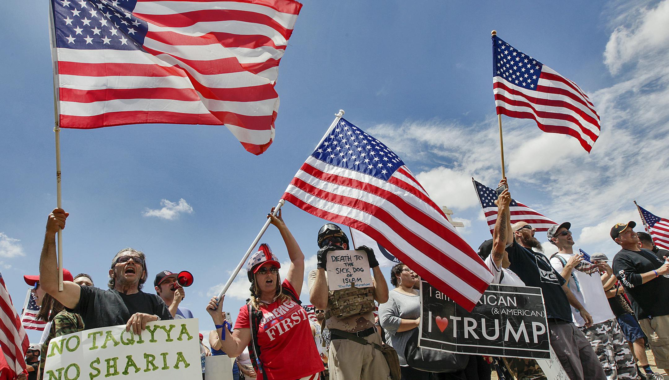 Anti-Sharia protesters at the site of the San Bernardino, Calif., terrorist attack as part of a nationwide "March Against Sharia"ù event sponsored by the conservative group Act for America on Saturday, June 10, 2017. Protesters chanted "USA!"ù and waved signs, including one that said "Islam is not American," near the county's Inland Regional Center, where a Pakistani American couple fatally shot 14 people in 2015. (Irfan Khan/Los Angeles Times/TNS) ORG XMIT: 1203900 ORG XMIT: MIN170610