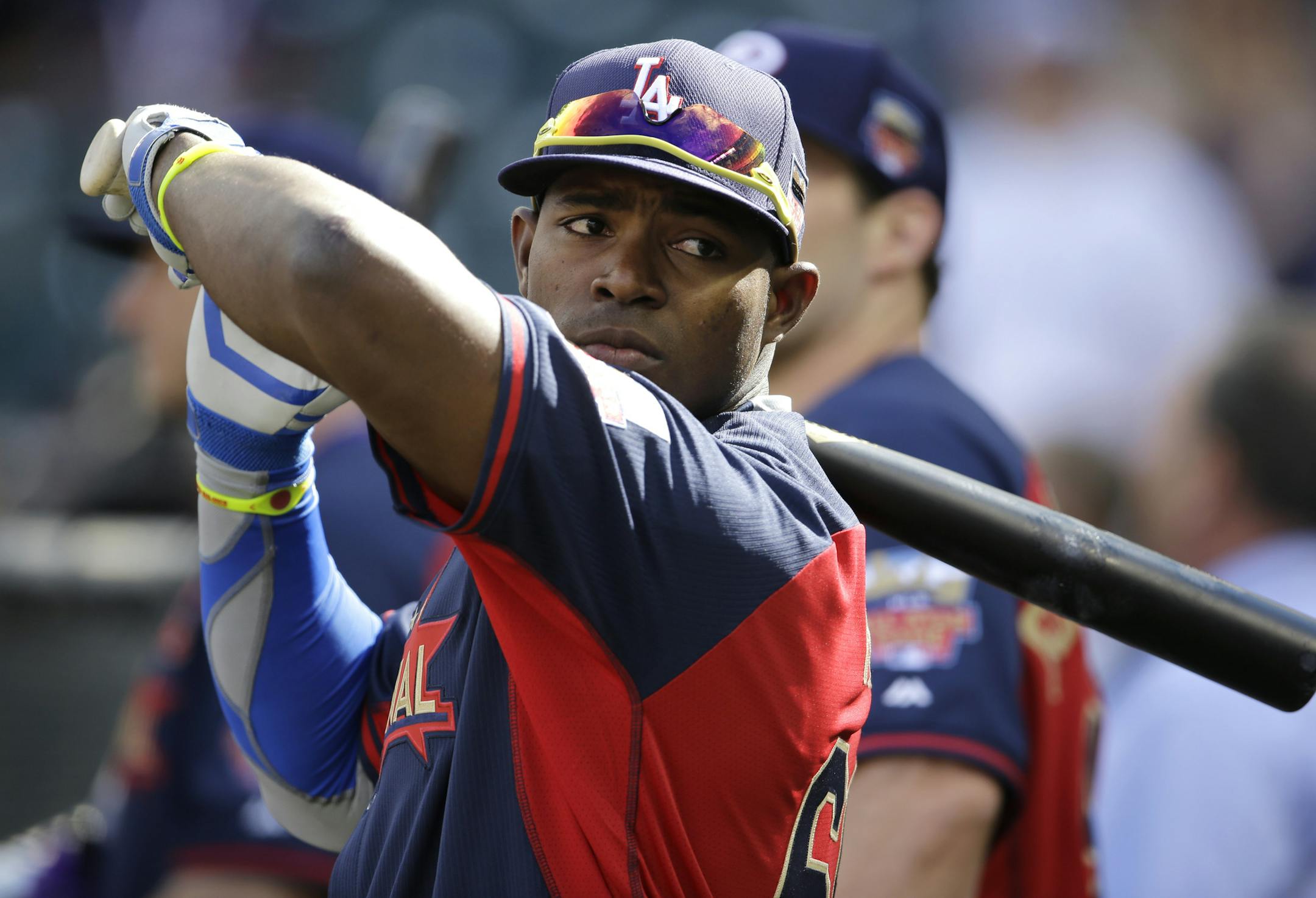 National League outfielder Yasiel Puig, of the Los Angeles Dodgers, waits to hit during batting practice before the MLB All-Star baseball game, Tuesday, July 15, 2014, in Minneapolis. (AP Photo/Paul Sancya)
