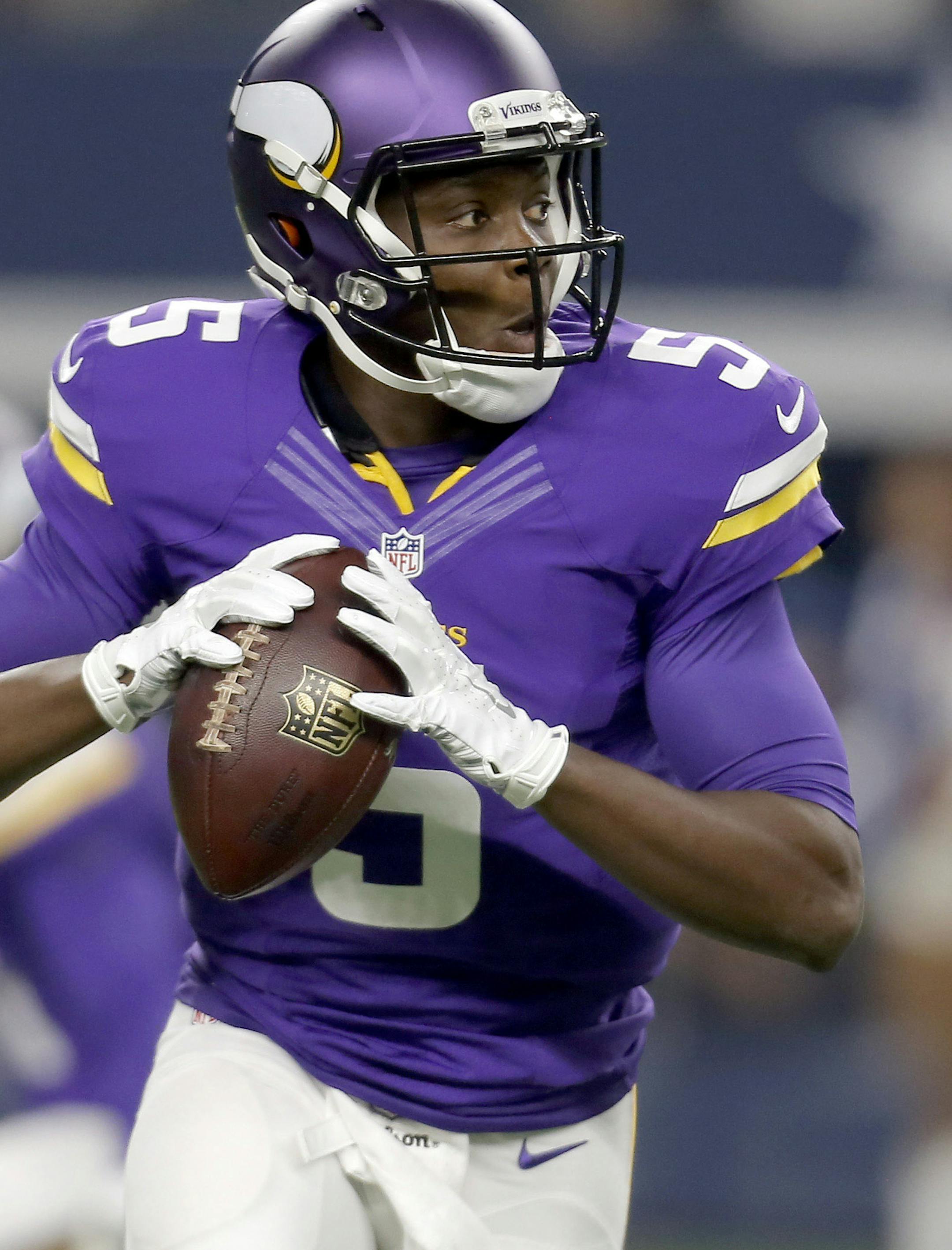 FILE - In this Aug. 29, 2015 file photo, Minnesota Vikings quarterback Teddy Bridgewater (5) rolls out to pass against the Dallas Cowboys during the first half of a preseason NFL football game in Arlington, Texas. (AP Photo/Brandon Wade, File)