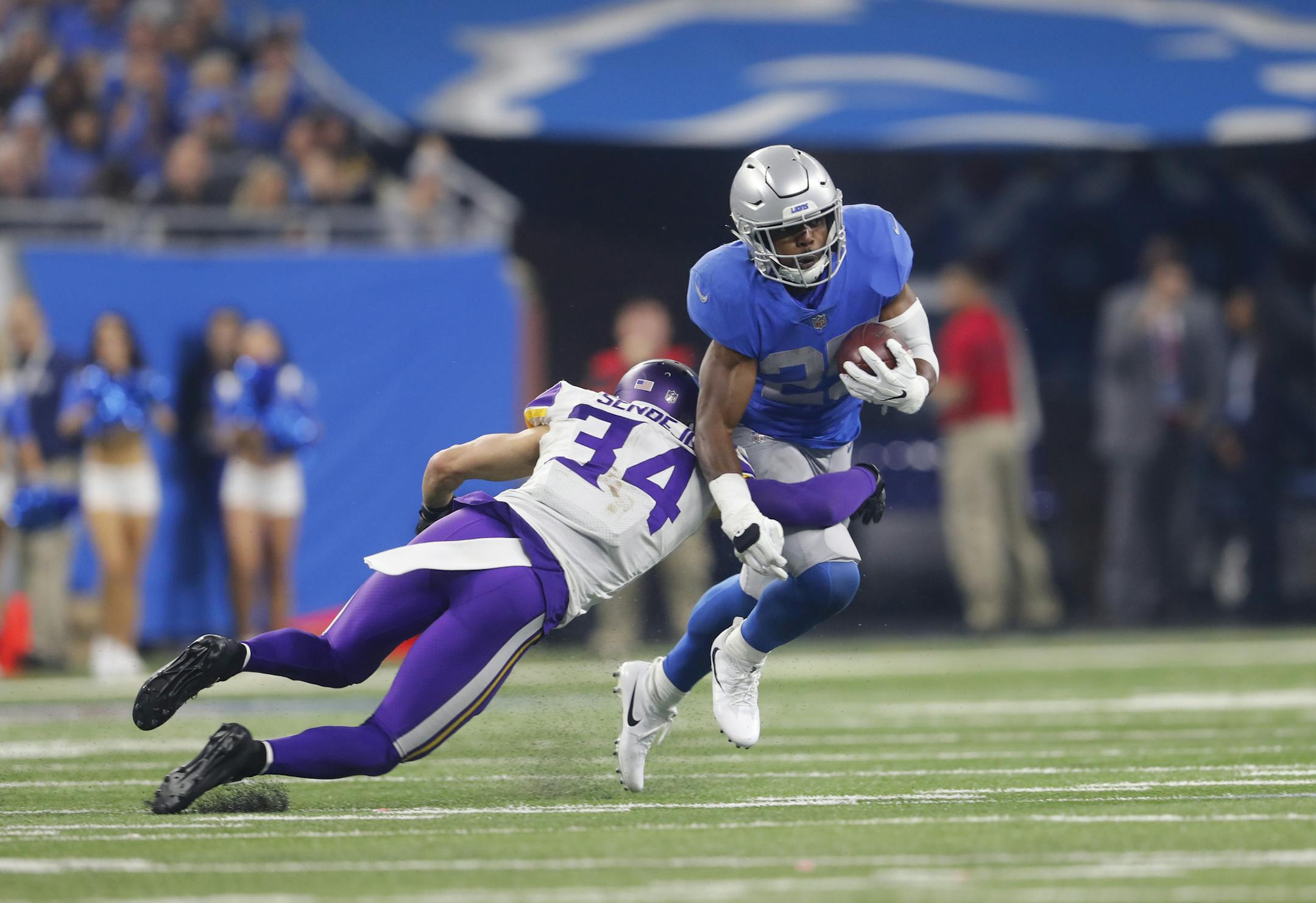 Minnesota Vikings strong safety Andrew Sendejo (34) tackles Detroit Lions running back Theo Riddick (25) during an NFL football game in Detroit, Thursday, Nov. 23, 2017. (AP Photo/Paul Sancya)