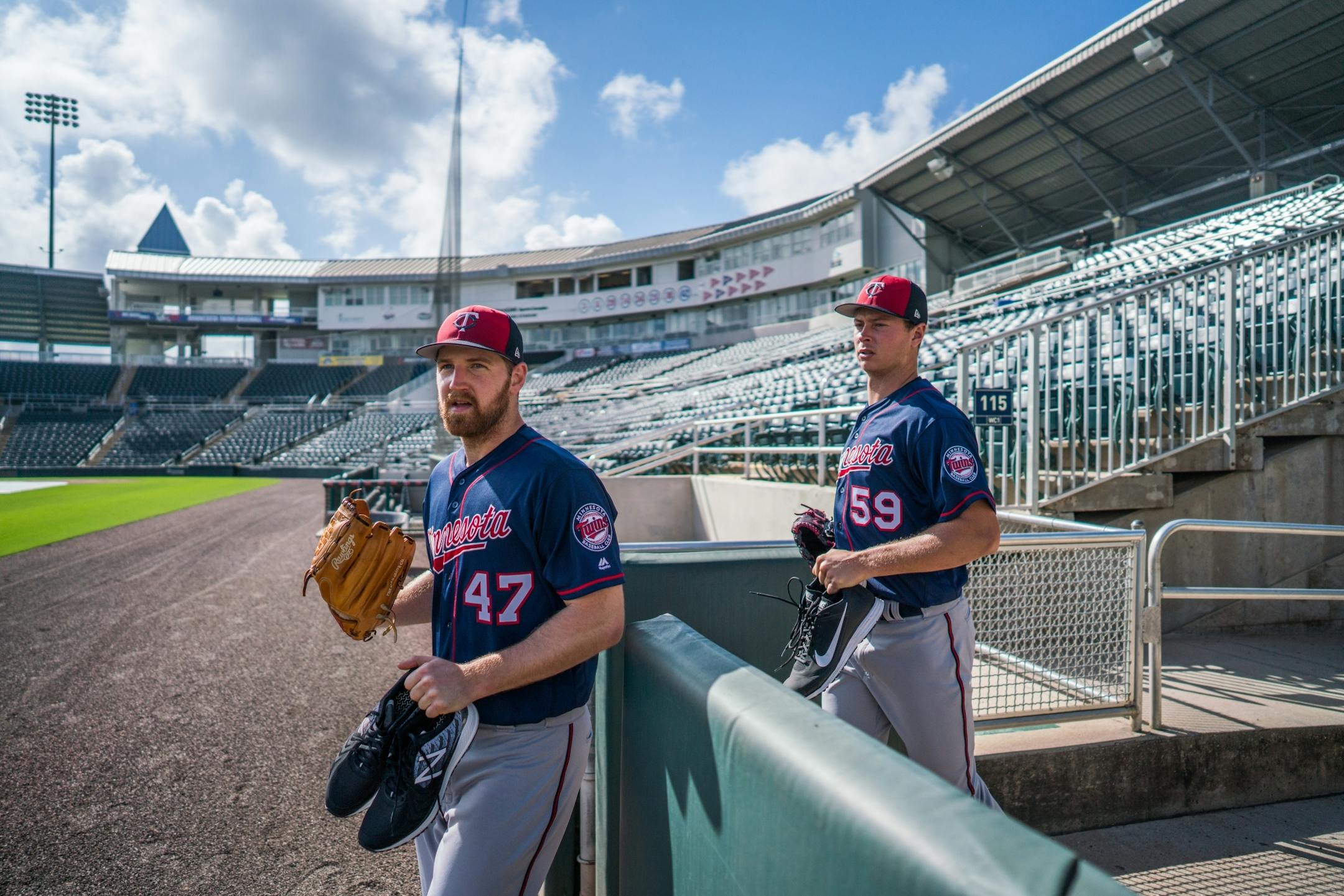 Twins pitchers Dietrich Enns and Stephen Gonsalves made their way onto the field at Hammond Stadium for drills.