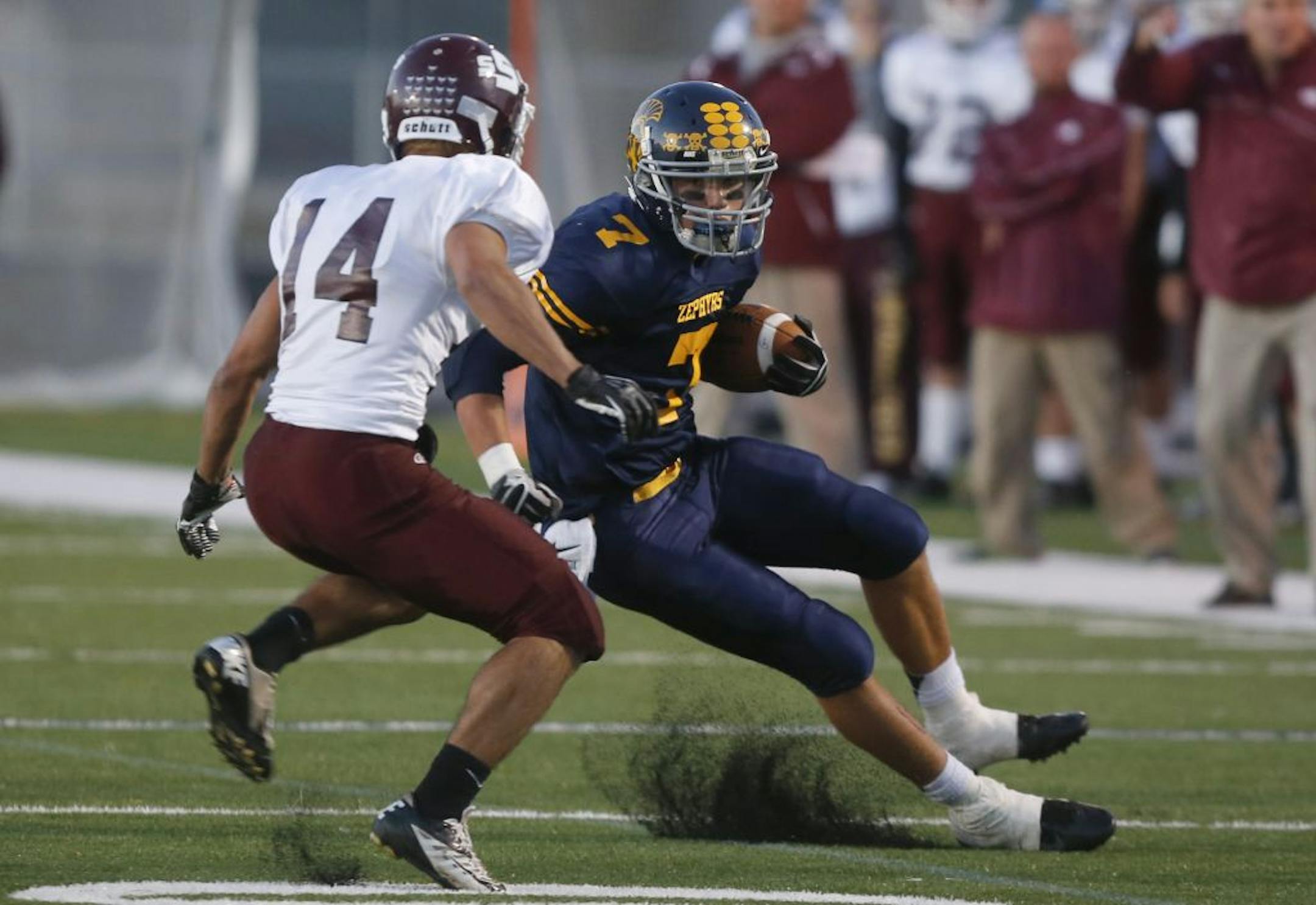 Mahtomedi's Jackson Hull tried to cut back with defender South St. Paul's Austen Bauer who was closing in the first half in Mahtomedi Min., Friday September 21, 2012.