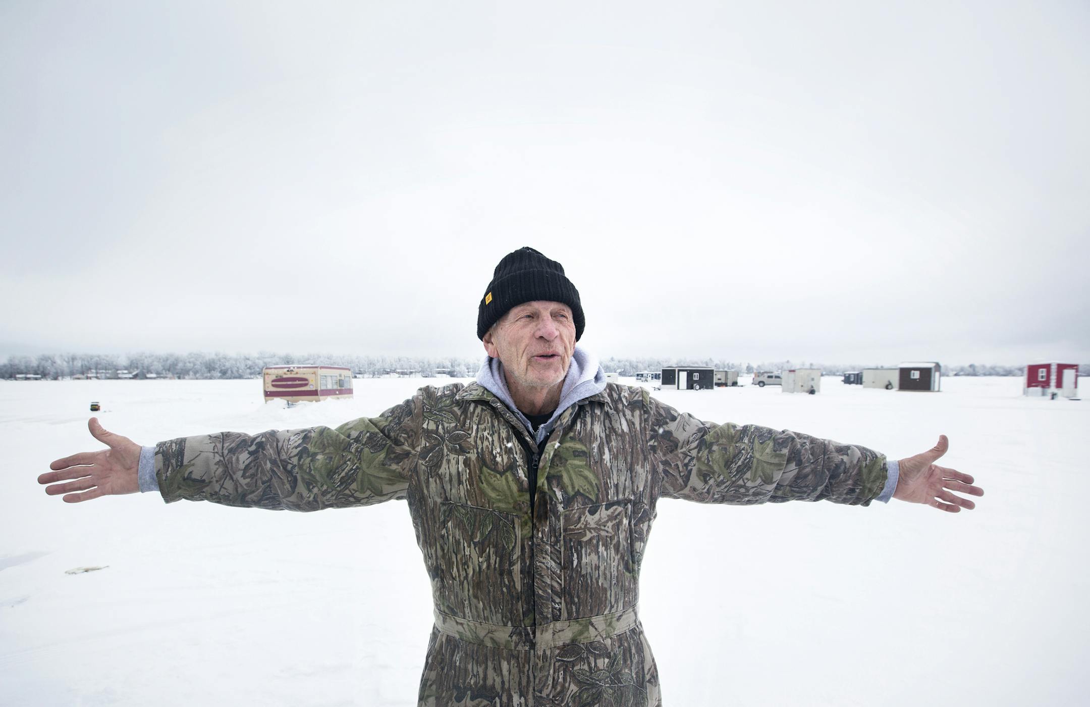 Jim Gabrick of Baxter celebrates being able to ice fish on North Long Lake in the Brainerd Lakes area on Thursday, January 21, 2016. ] (Leila Navidi/Star Tribune) leila.navidi@startribune.com