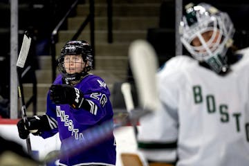 Kendall Coyne Schofield of Minnesota celebrates after scoring a goal in the first period.