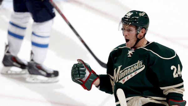 Matt Cooke of the Minnesota Wild celebrated after scoring a goal in the second period.