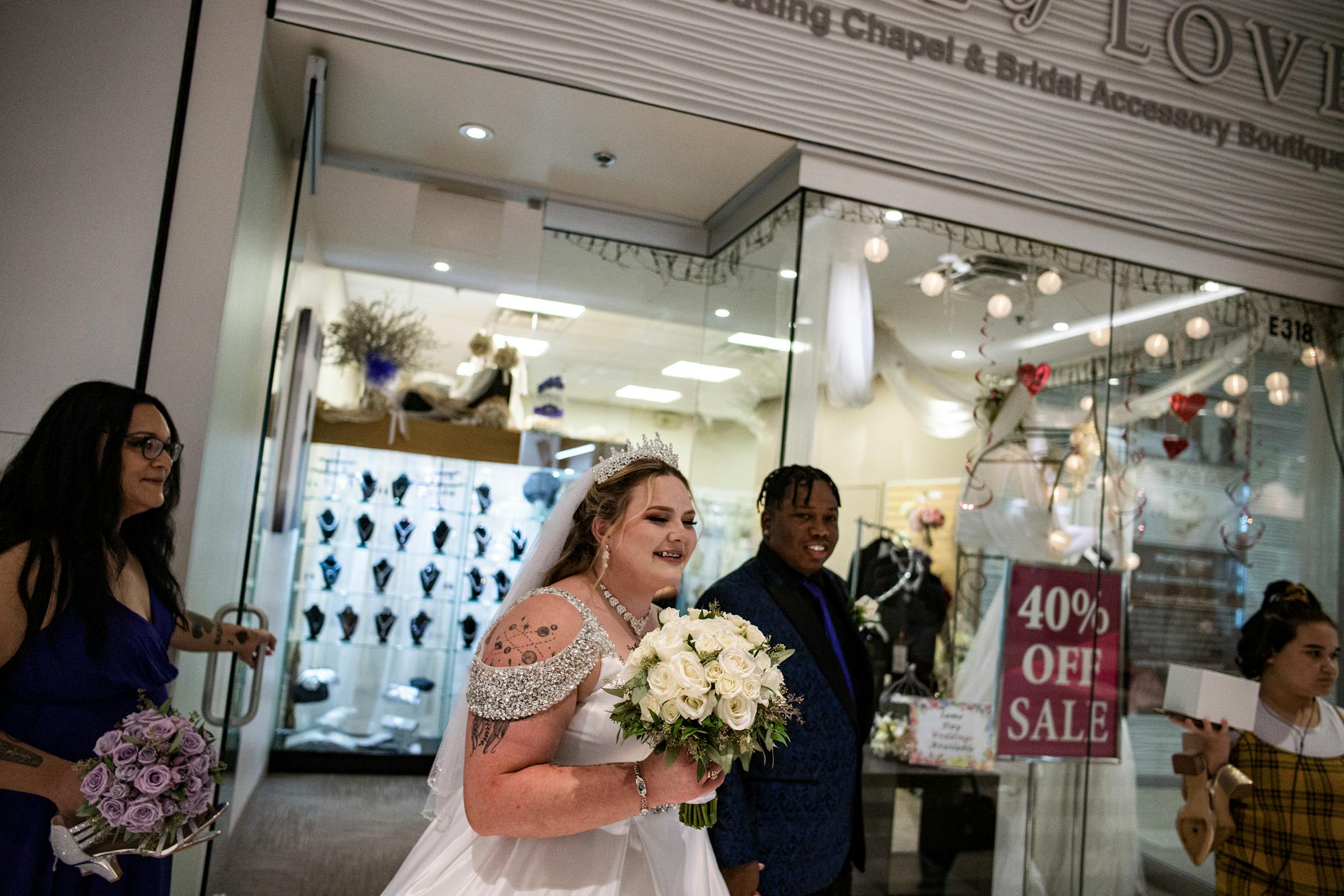 Andrea and Samuel Price walk out of the Chapel of Love and through the Mall of America as a newly married couple.