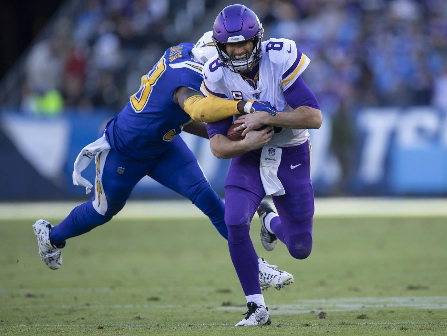 Minnesota Vikings quarterback Kirk Cousins (8) picked up a first down as Los Angeles Chargers outside linebacker Thomas Davis (58) tried to strip the ball in the third quarter .] Jerry Holt &#x2022; Jerry.Holt@startribune.com The Minnesota Vikings defeated the Los Angeles Chargers 39-10 in an NFL football game Sunday , December 15, 2019 at Dignity Health Sports Park in Carson, CA.