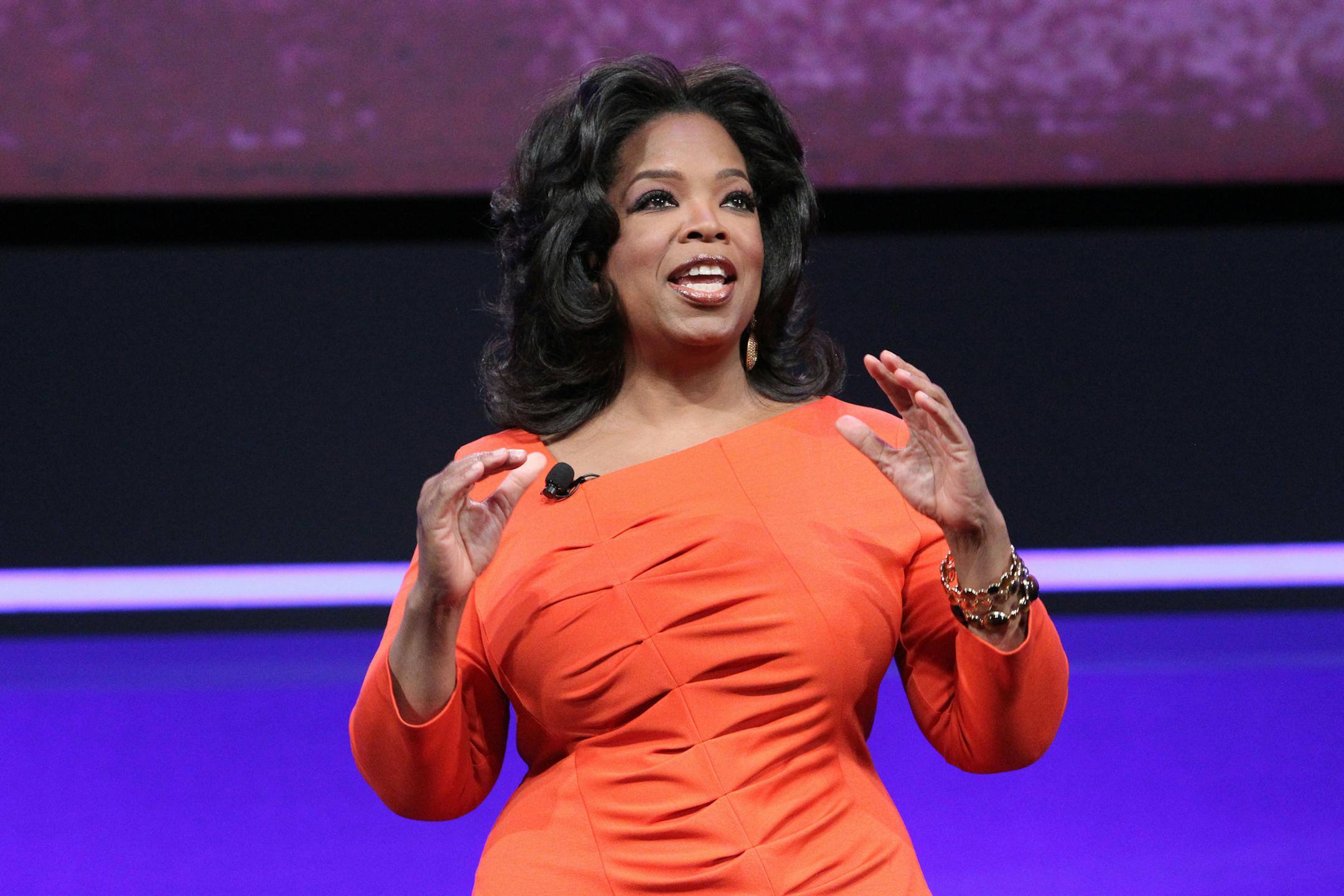 FILE - In this April 14, 2011 publicity image originally released by OWN, TV personality and media mogul Oprah Winfrey presents at the OWN: Oprah Winfrey Network portion of the Discovery Communications Upfront at Jazz at Lincoln Center in New York. Oprah Winfrey's struggling network, OWN, is laying off 30 workers and restructuring its operations in New York and Los Angeles. (AP Photo/OWN, George Burns) MANDATORY CREDIT: GEORGE BURNS/OWN