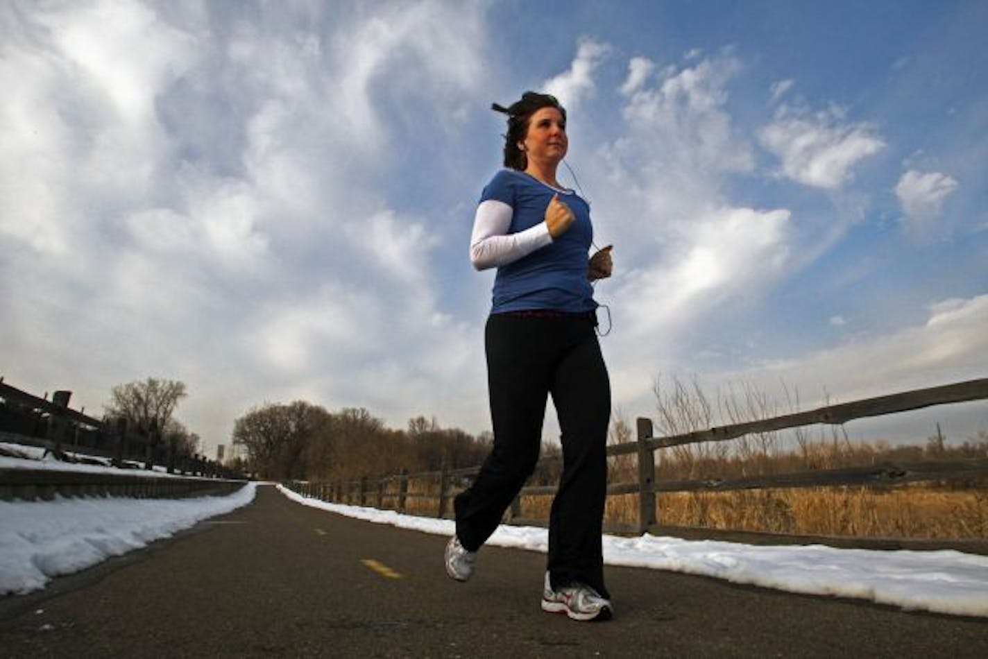 Emmert jogged on a park path across from her townhome.