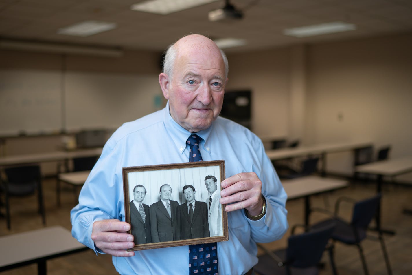 Former DFL legislator Steve Wenzel of Little Falls held a photo of himself taken June of 1972 of himself with DFL heavy hitters Walter Mondale, Hubert Humphrey, Wenzel and Wendell Anderson, taken on the occasion of a DFL takeover of the House in the last election. Wenzel now supports Donald Trump. ] GLEN STUBBE • glen.stubbe@startribune.com Monday, August 24, 2020