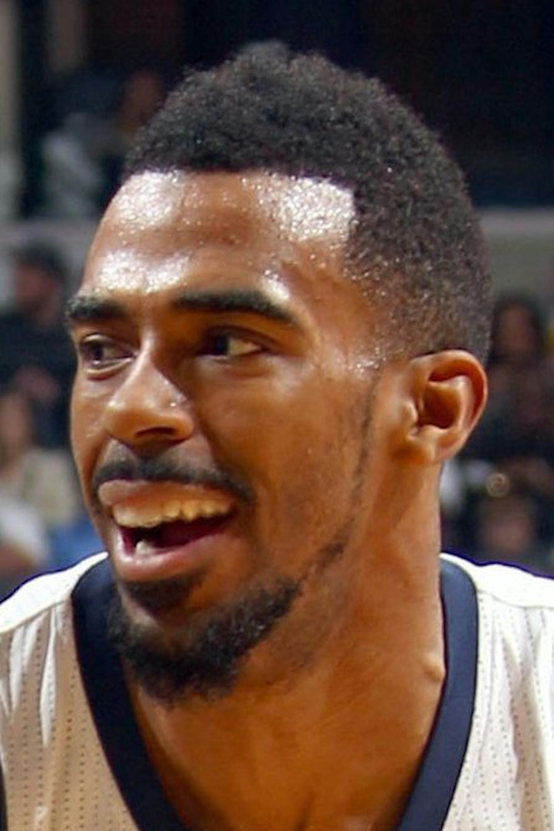 Memphis Grizzlies guard Mike Conley (11) tries to drive to the basket against the defense of New Orleans Pelicans guard Brian Roberts (22) at the FedExForum in Memphis, Tenn., on Monday, Jan. 20, 2014. (Nikki Boertman/The Commercial Appeal/MCT) ORG XMIT: 1148099