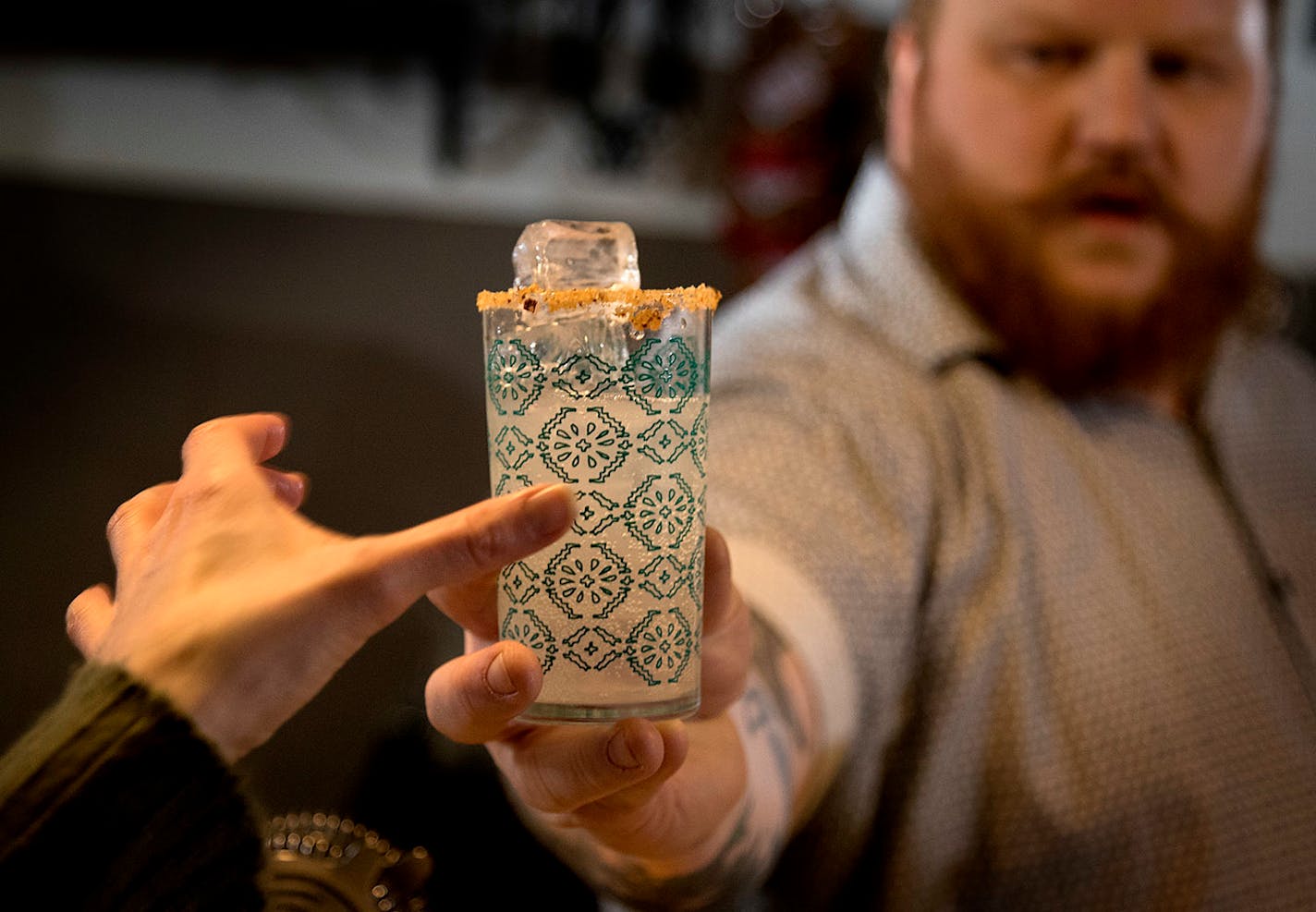 Nick Kosevich passes out a drink called Hecho en Mexico, or Made in Mexico, during a cocktail-making class at Lawless Distilling.