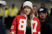FILE - Taylor Swift wears a Kansas City Chiefs tight end Travis Kelce jacket as she arrives before an NFL wild-card playoff football game between the 