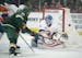 Minnesota Wild left wing Marcus Foligno's (17) backhander in the first period was a little wide of the goal and New York Islanders goaltender Thomas G