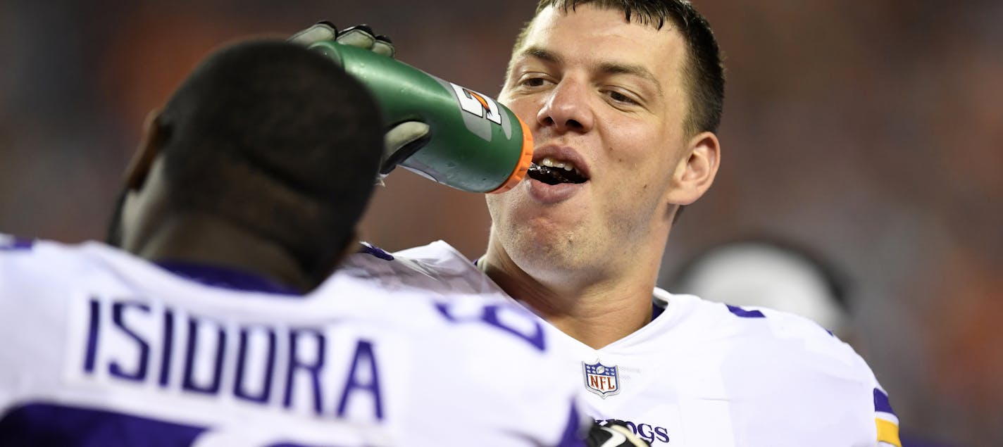 Minnesota Vikings guard Tom Compton on the sidelines in the second half of an NFL football game against the Denver Broncos Saturday, Aug. 11, 2018, in Denver. (AP Photo/Mark Reis)