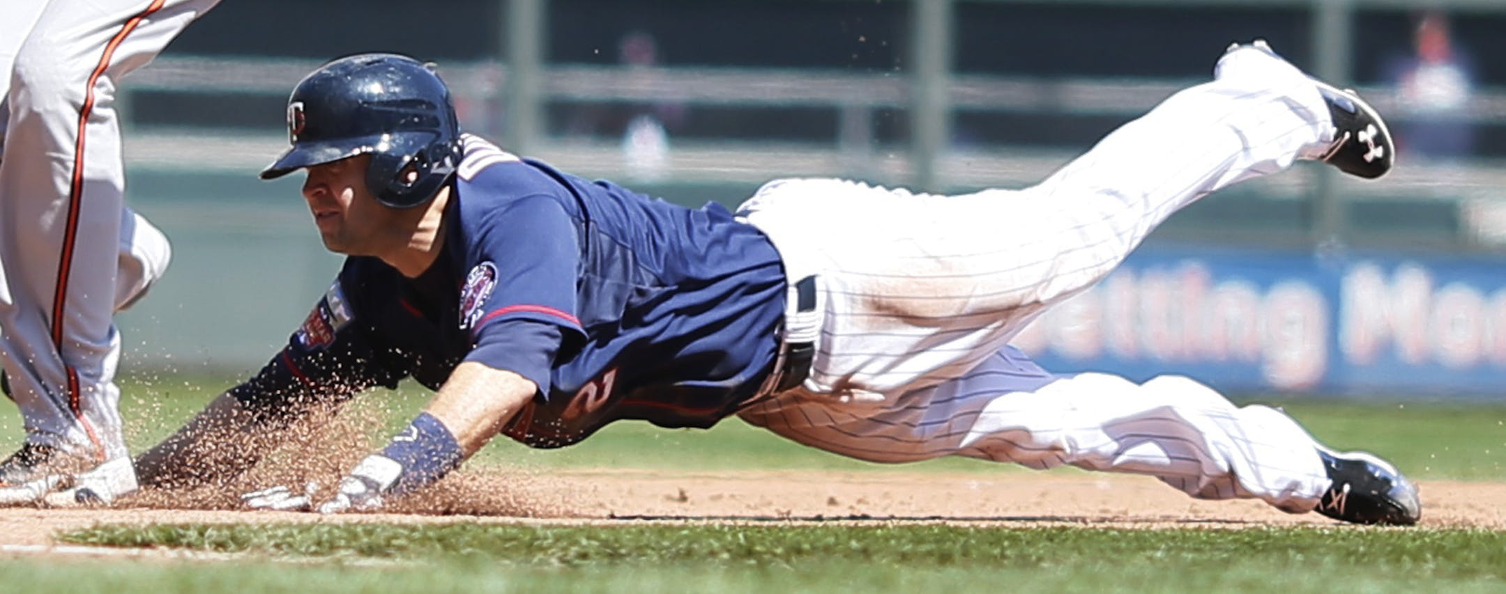 Minnesota Twins second baseman Brian Dozier (2) stole second third base over Baltimore Orioles third baseman Manny Machado (13) in the 5th inning during MLB action between the Minnesota Twins and Baltimore Orioles at Target Field May 4, 2014 in Minneapolis, MN. ] Jerry Holt Jerry.holt@startribune.com ORG XMIT: MIN1405041507415018