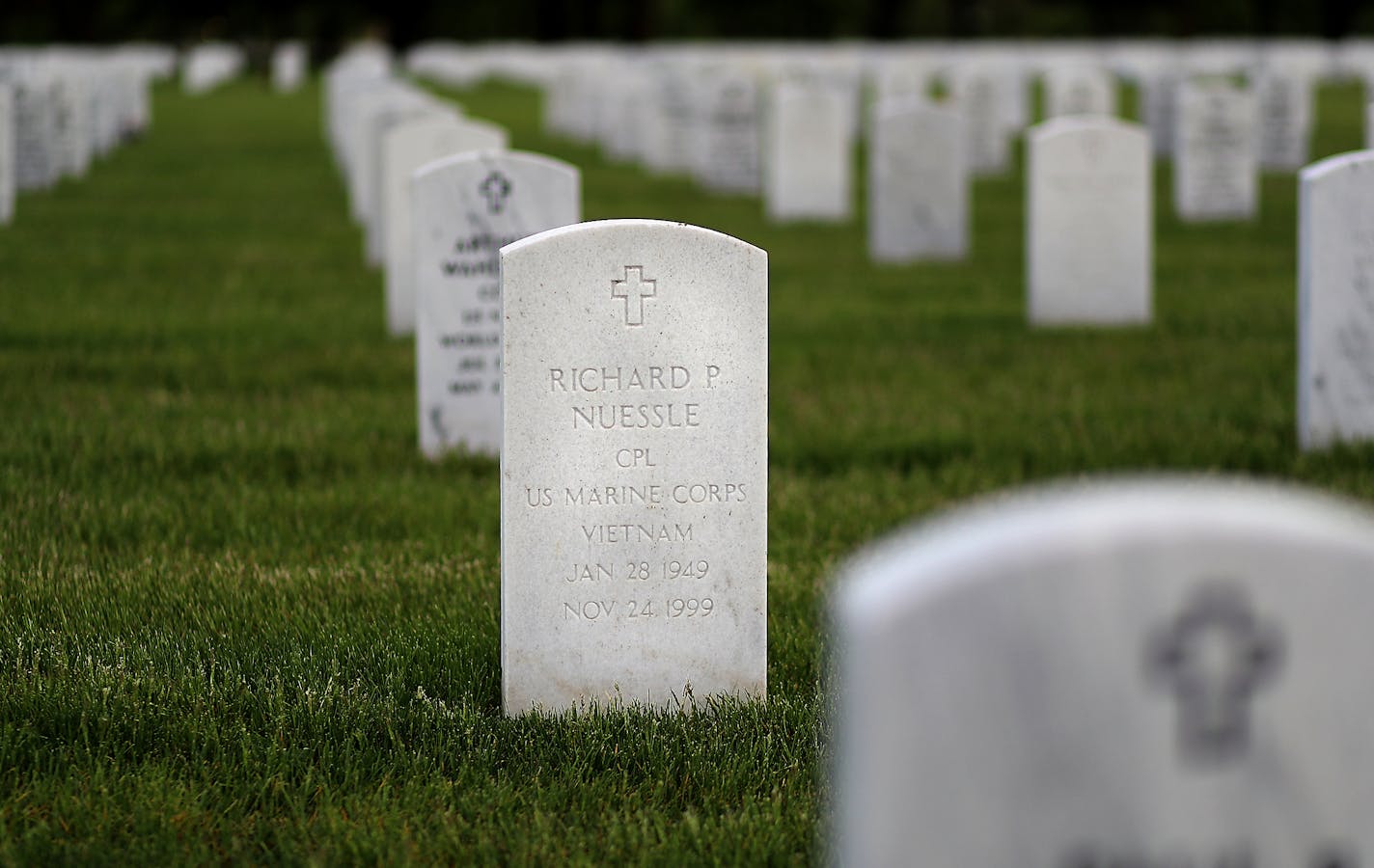 The grave of Rich Nuessle, a TV photographer at Channel 11 and elsewhere, loved by all but traumatized until his death by being in the middle of it as a combat Marine in Vietnam and seen Wednesday, May 20, 2020, at Fort Snelling National Cemetery in Minneapolis, MN.] DAVID JOLES • david.joles@startribune.com Special Memorial Day column from Patrick Reusse, telling the story of Rich Nuessle