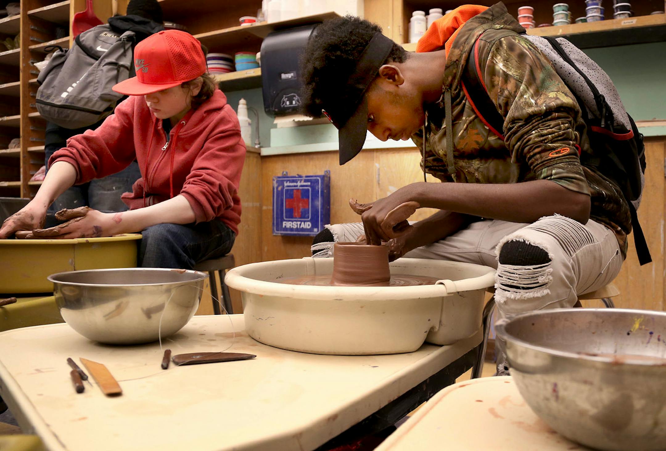 Edison High 10th Ali Hussan works on throwing a bowl for the Empty Bowls fundraiser at Edison High School Thursday, April 13, 2017, in Minneapolis, MN.
