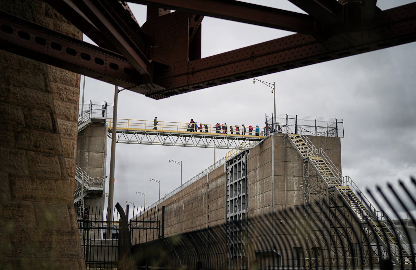 A group of visiting students crossed the bridge at the opening of the lock and dam in Minneapolis. Plans to transform the lock and dam beside the Stone Arch Bridge into a visitors center and recreation area are taking shape with a tentative $2.8 million commitment from the state -- which will be largely matched by private funds. The Friends of the Lock and Dam, which is pushing the idea, has appointed Mark Andrew as its president. But a lot is still in limbo. The Army Corps of Engineers still ha