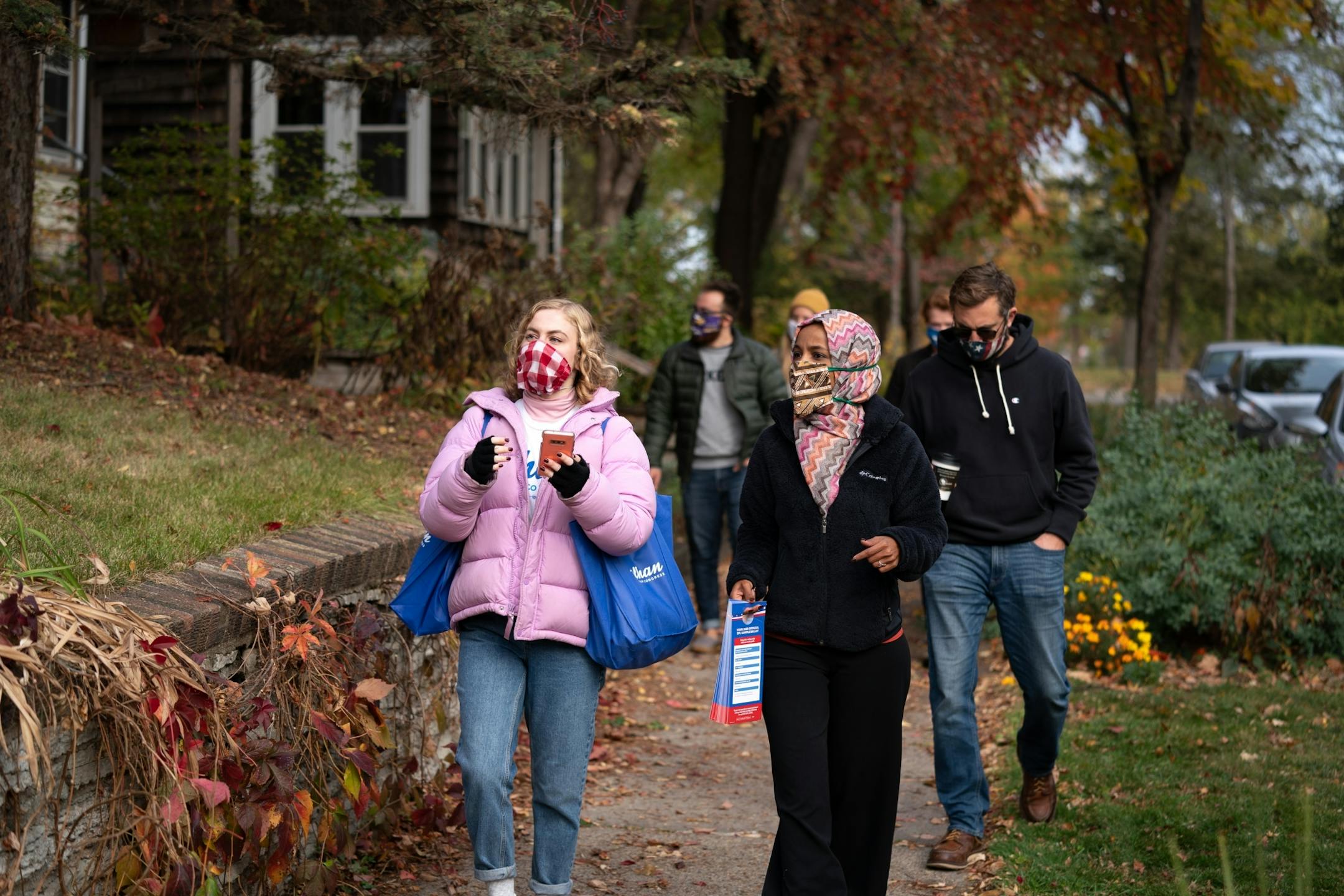 U.S. Rep Ilhan Omar knocked on doors in the Powderhorn Park neighborhood with staffer Becca Young.