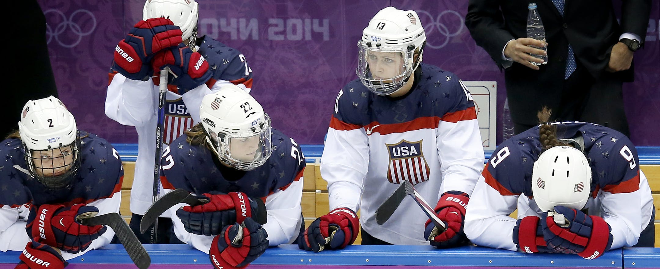 Members of Team USA, including former Gophers defenseman Megan Bozek (far right), watched in disbelief as their gold medal hopes vanished.