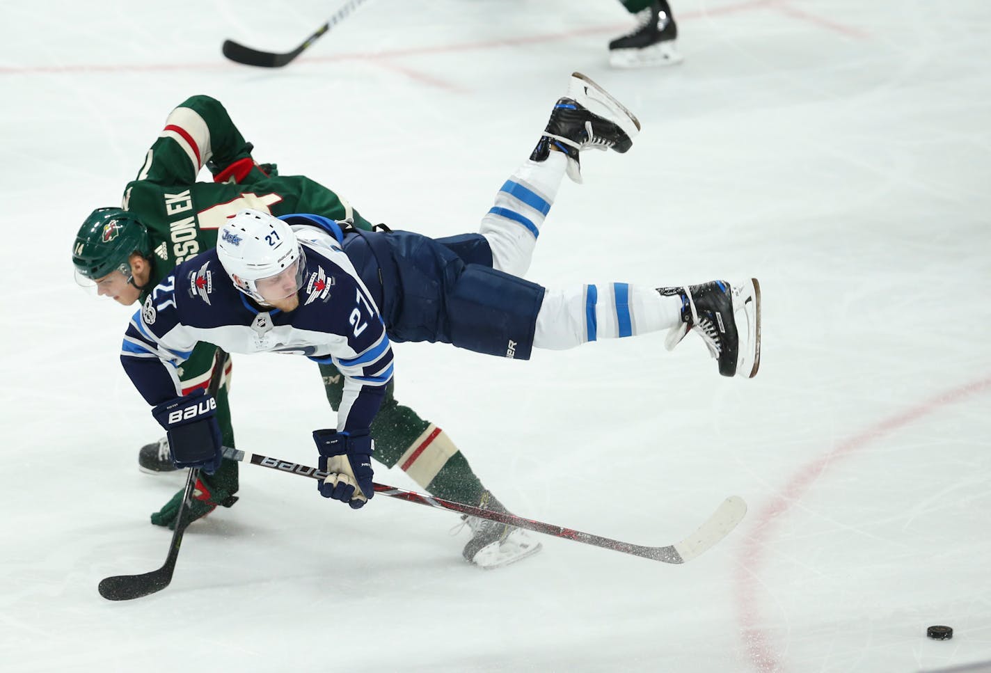 The Wild's Joel Eriksson Ek was upended by the Jets' Nikolaj Ehlers in the second period on Tuesday. Ehlers later scored the game-winning goal as Winnipeg held on to win 2-1 at Xcel Energy Center.