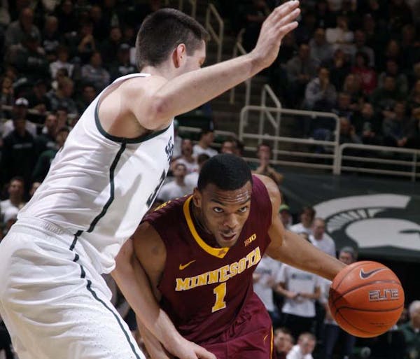 Gophers guard Andre Hollins drove against Michigan State's Kenny Kaminski during the first half Saturday.