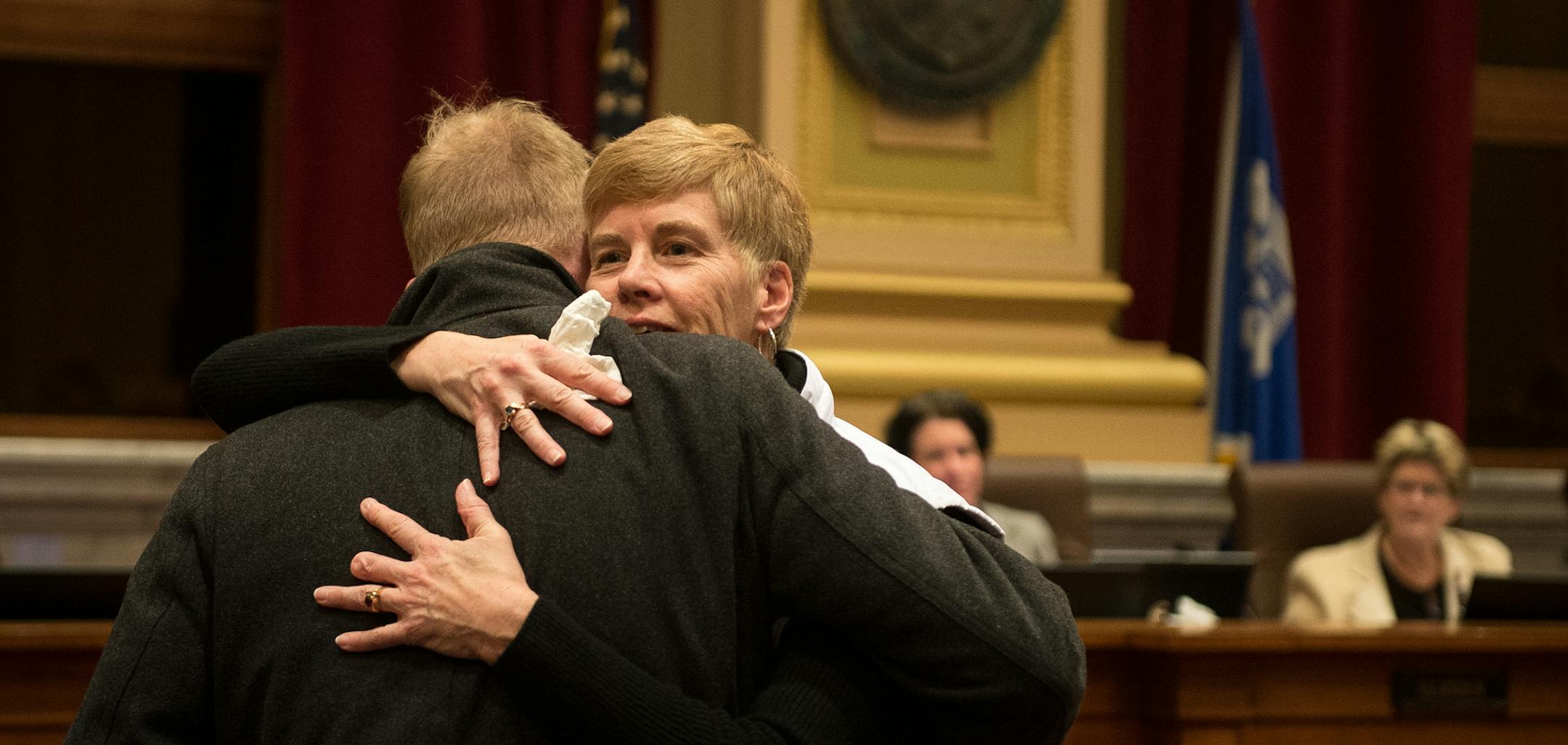 Minneapolis Park Board Commissioner Jon Olson hugged superintendent Jayne Miller before the start of Wednesday night's city council meeting in which Miller's resignation was announced. ] AARON LAVINSKY &#x2022; aaron.lavinsky@startribune.com Minneapolis Park Board Superintendent Jayne Miller announced her resignation Wednesday night in the Minneapolis City Council chambers at city hall on Wednesday, Dec. 6, 2017.
