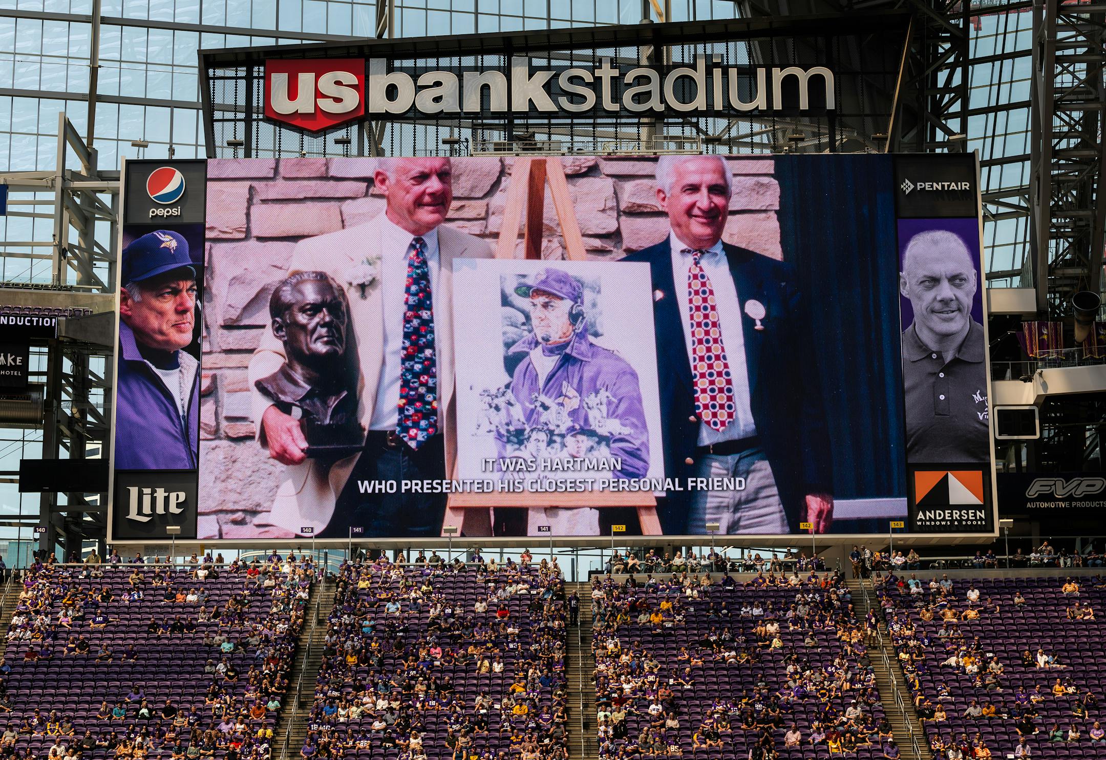 Bud Grant and Sid Hartman on the big screen during a public celebration of for Minnesota Vikings coach Bud Grant.