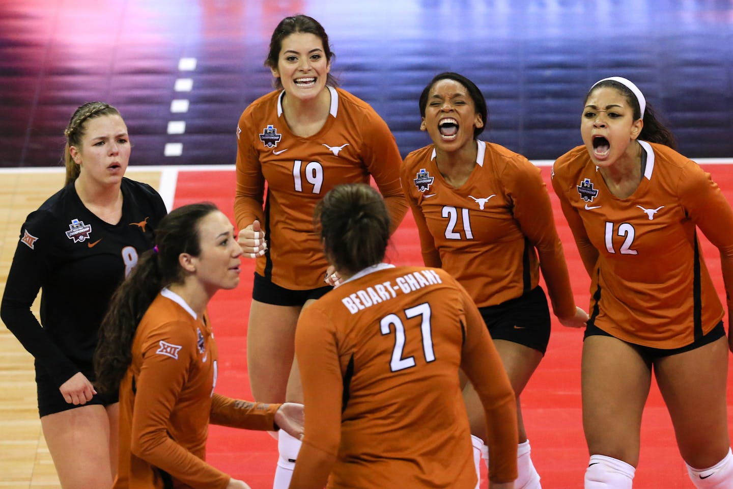 Texas' Amy Neal, front left, and teammates celebrate a point against Minnesota during an NCAA women's volleyball tournament semifinal in Omaha, Neb., Thursday, Dec. 17, 2015. (AP Photo/Nati Harnik)